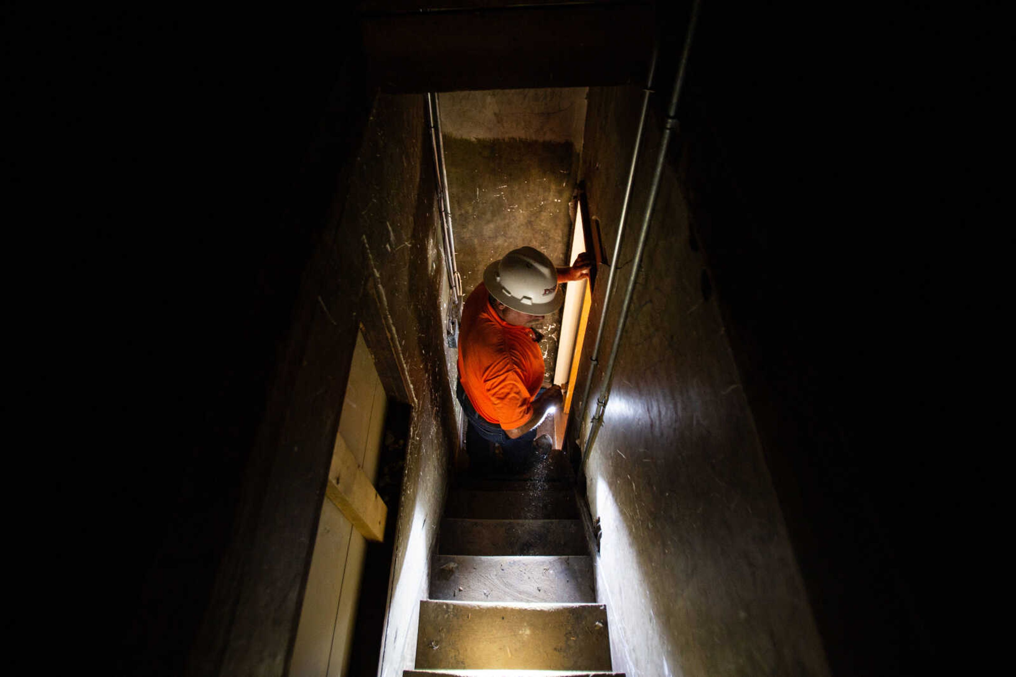 Project superintendent David Marigeaux descends the narrow attic staircase of the Common Pleas Courthouse as renovation continues on the historic structure on Tuesday, June 16, 2020.