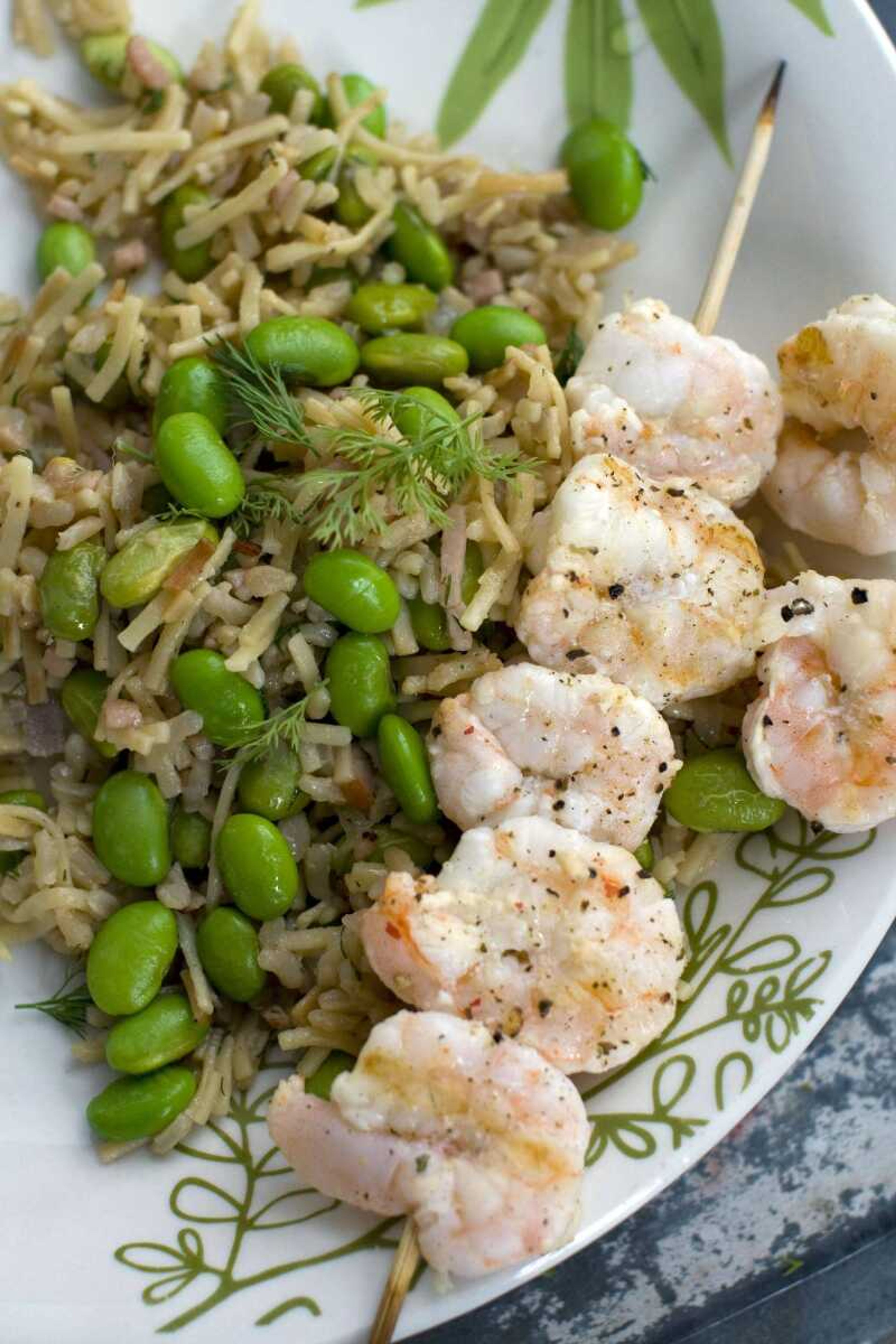 Rice and noodle pilaf with edamame and grilled shrimp is a one-pot meal that can be on the table in around 35 minutes. (Matthew Mead ~ Associated Press)