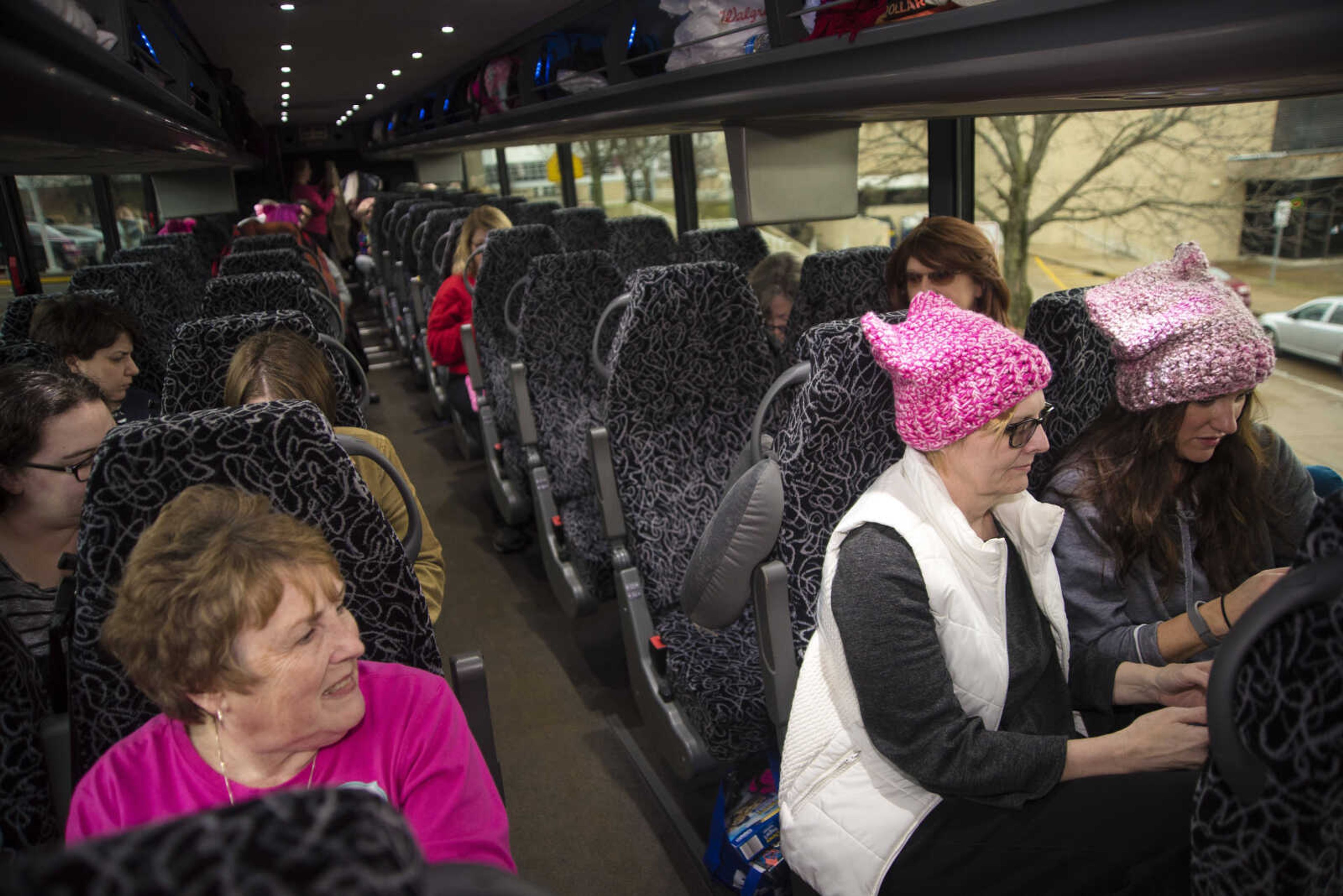 Protestors get ready to travel to Washington D.C. to participate in the Women's March on Saturday as they get ready to leave Friday, Jan. 20, 2017 in the Scully Building parking lot at Southeast Missouri State University in Cape Girardeau.