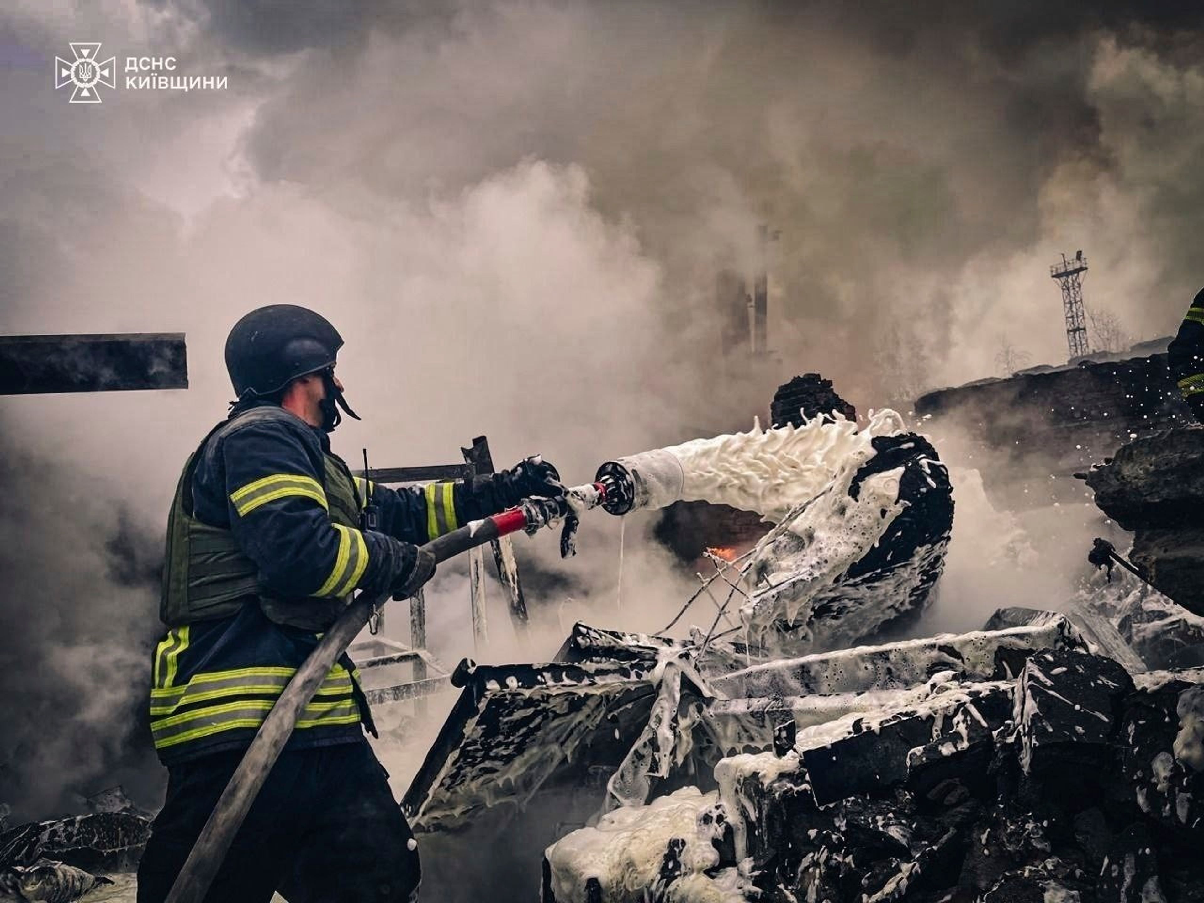 In this photo provided by the Ukrainian Emergency Service on Nov. 13, 2024, rescue workers extinguish a fire of a building destroyed by a Russian strike in Brovary, outside Kyiv, Ukraine. (Ukrainian Emergency Service via AP)