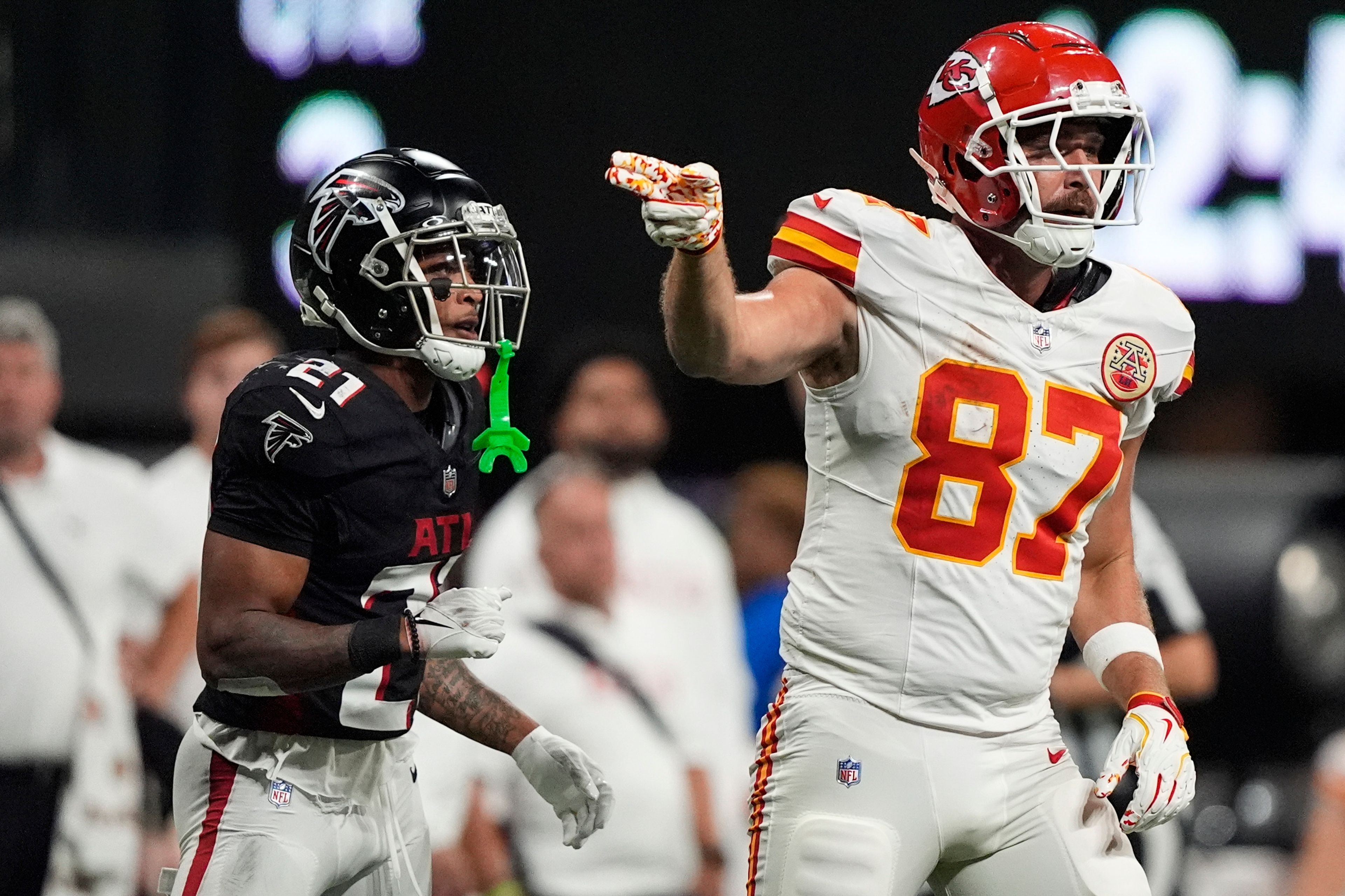 Kansas City Chiefs tight end Travis Kelce (87) celebrates a catch against Atlanta Falcons cornerback Mike Hughes (21) during the second half of an NFL football game, Sunday, Sept. 22, 2024, in Atlanta. (AP Photo/Brynn Anderson)