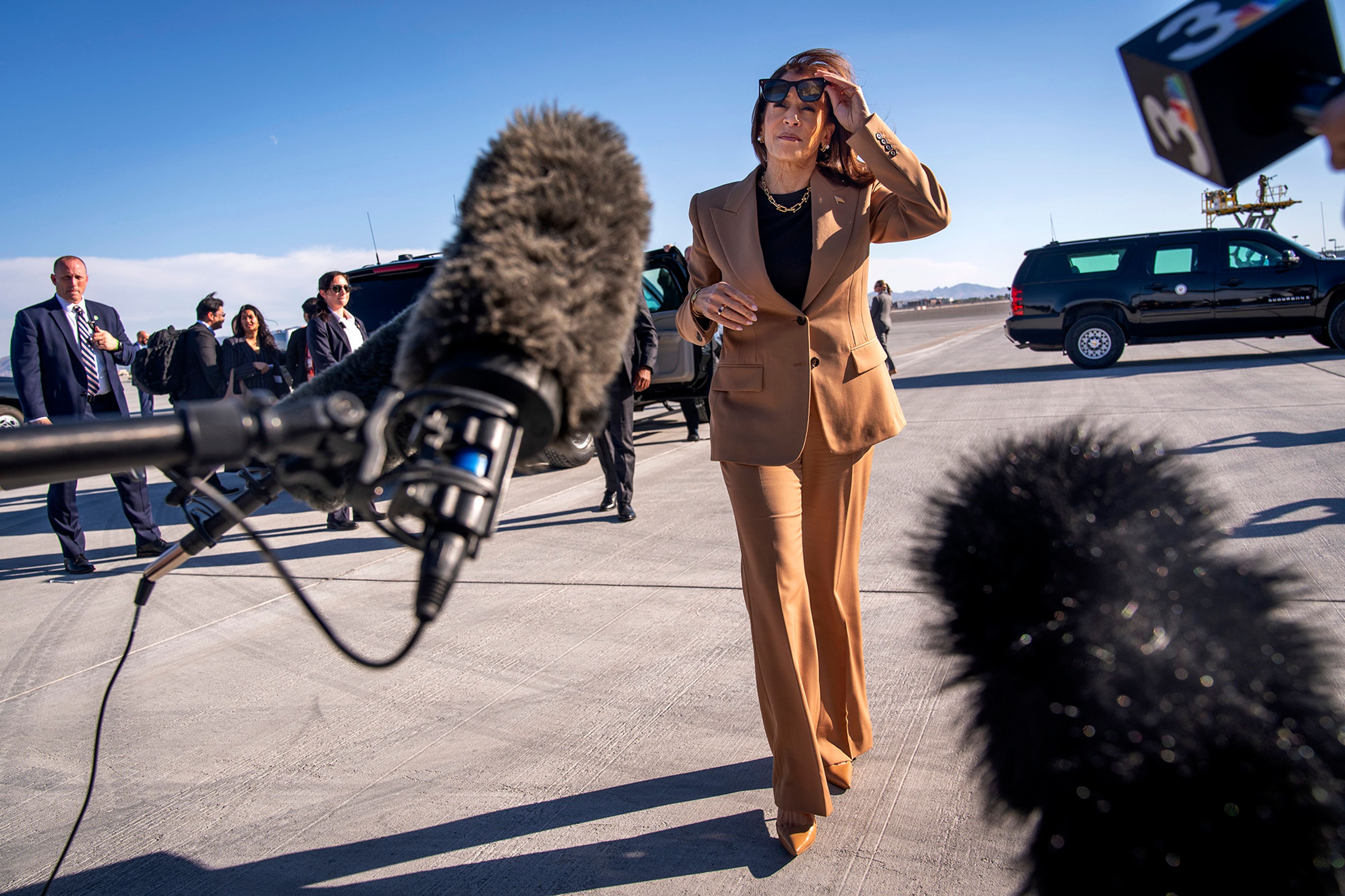 Democratic presidential nominee Vice President Kamala Harris walks toward reporters to speak before boarding Air Force Two, as she departs Las Vegas from Harry Reid International Airport, Thursday, Oct. 10, 2024, en route to Arizona. 