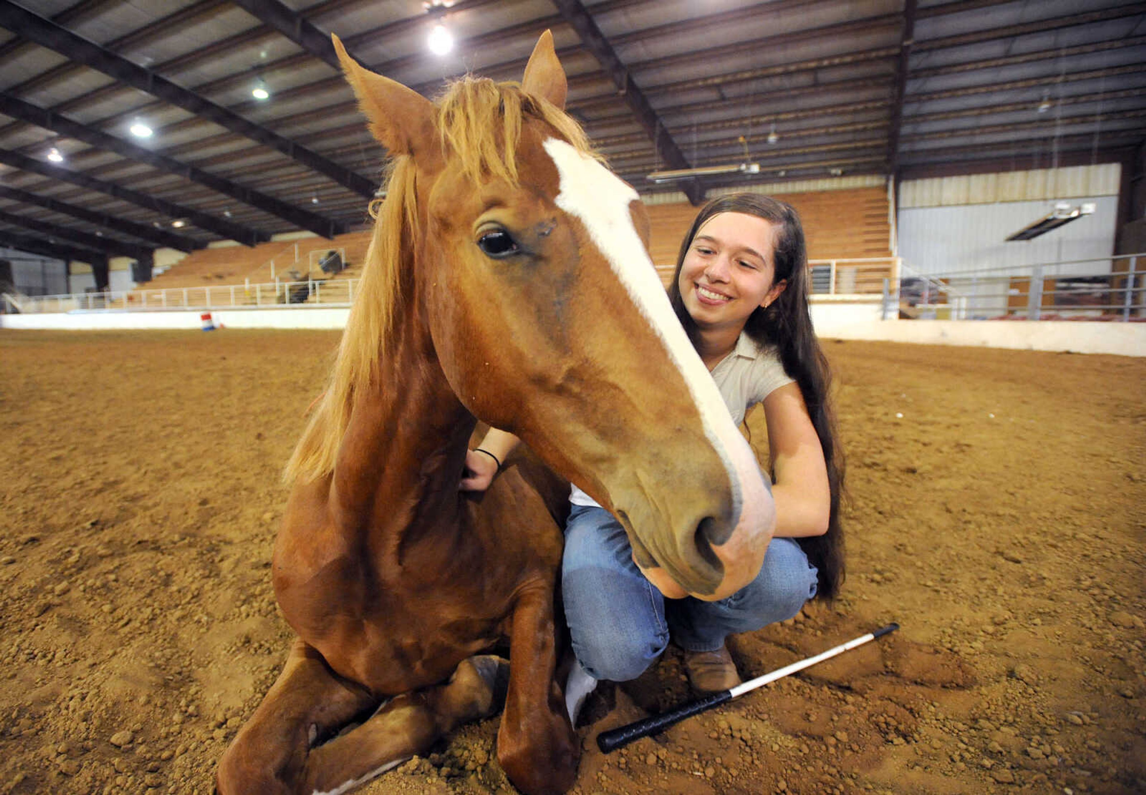 LAURA SIMON ~ lsimon@semissourian.com

Allison Elfrink and her wild mustang, Chico, at Flickerwood Arena in Jackson, Missouri, Wednesday, Aug. 5, 2015.