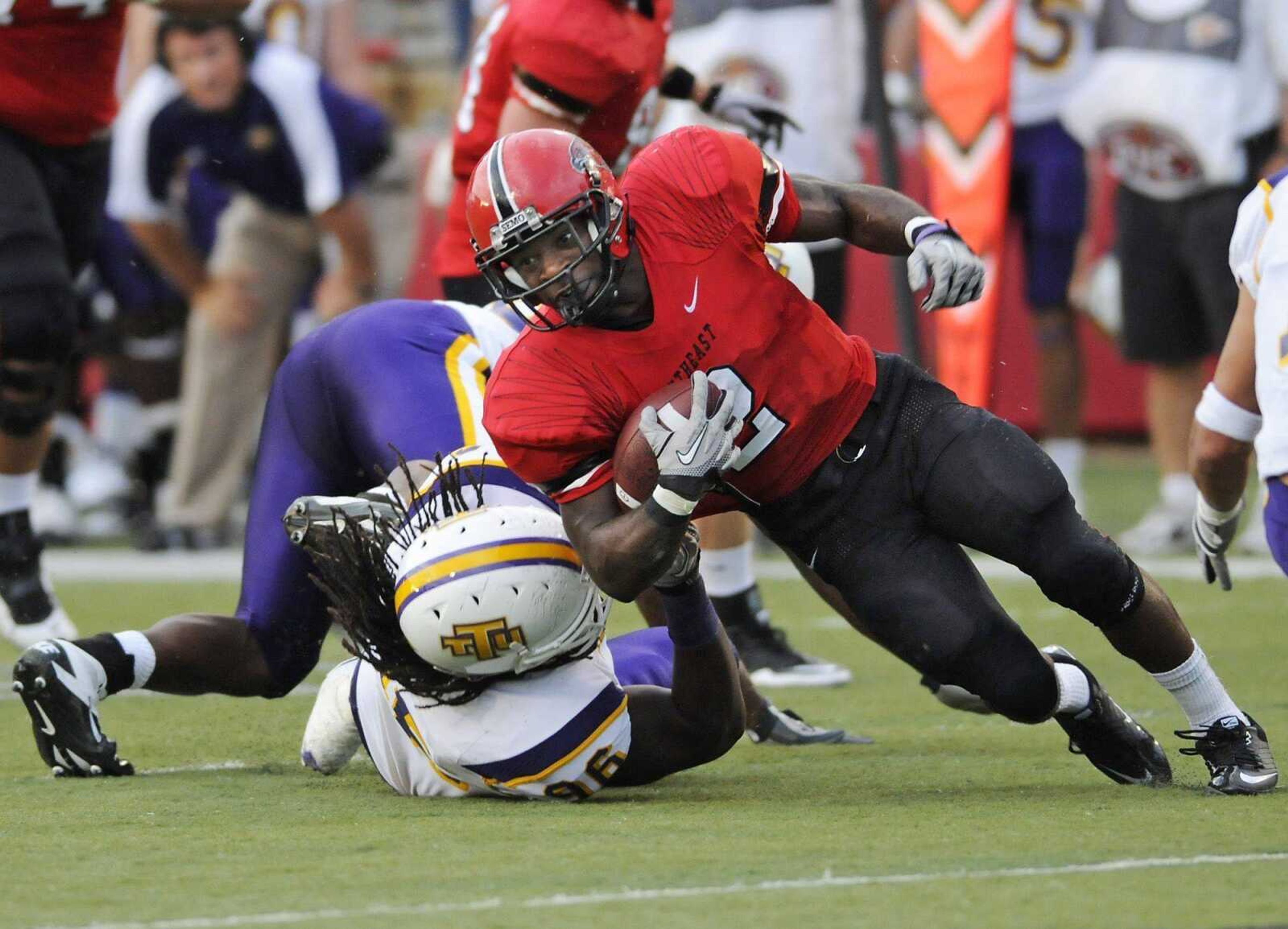 Southeast Missouri State running back Henry Harris picks up yardage in the Redhawks' home-opening win against Tennessee Tech. Harris has four consecutive 100-yard rushing games and ranks fourth nationally with 680 rushing yards. (Kristin Eberts)