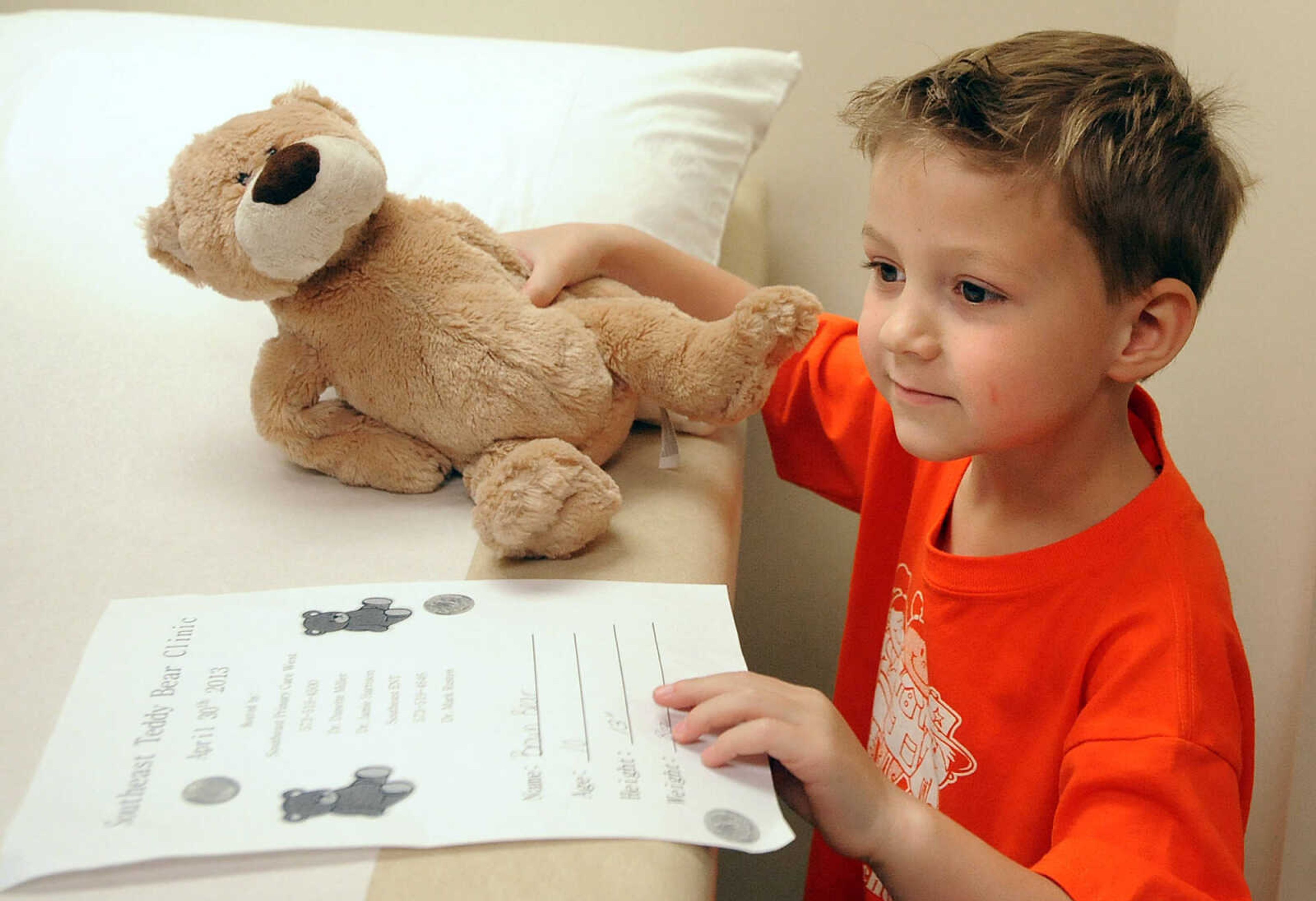 LAURA SIMON ~ lsimon@semissourian.com

Ben Austin Miller sets Brown Bear on the exam table Tuesday morning, April 30, 2013 at SoutheastHEALTH Primary Care in Cape Girardeau. Big Stuff preschool students got to bring their stuffed animals, ranging from teddy bears to tigers, in for exams Tuesday.