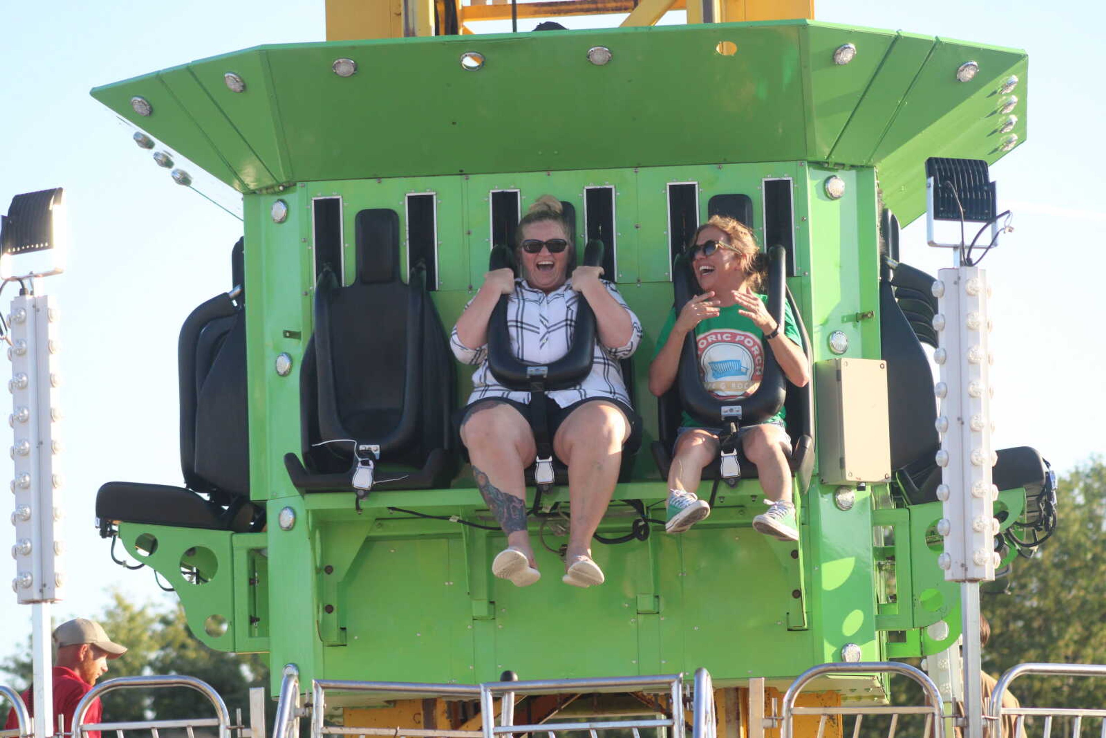 Chasity Ratliff and Kala Groves ride the drop tower ride at the SEMO District fair.&nbsp;