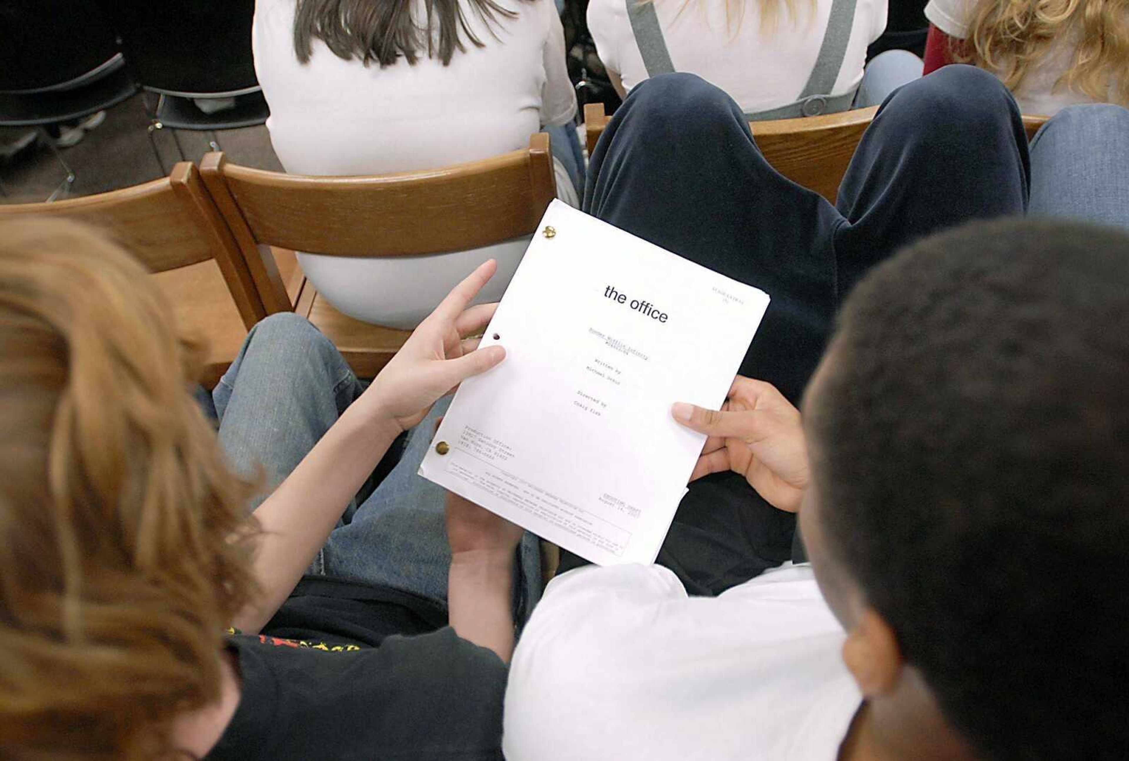 Students passed around a script from " The Office" that Phyllis Smith brought Monday during her visit to Jackson Junior High School.