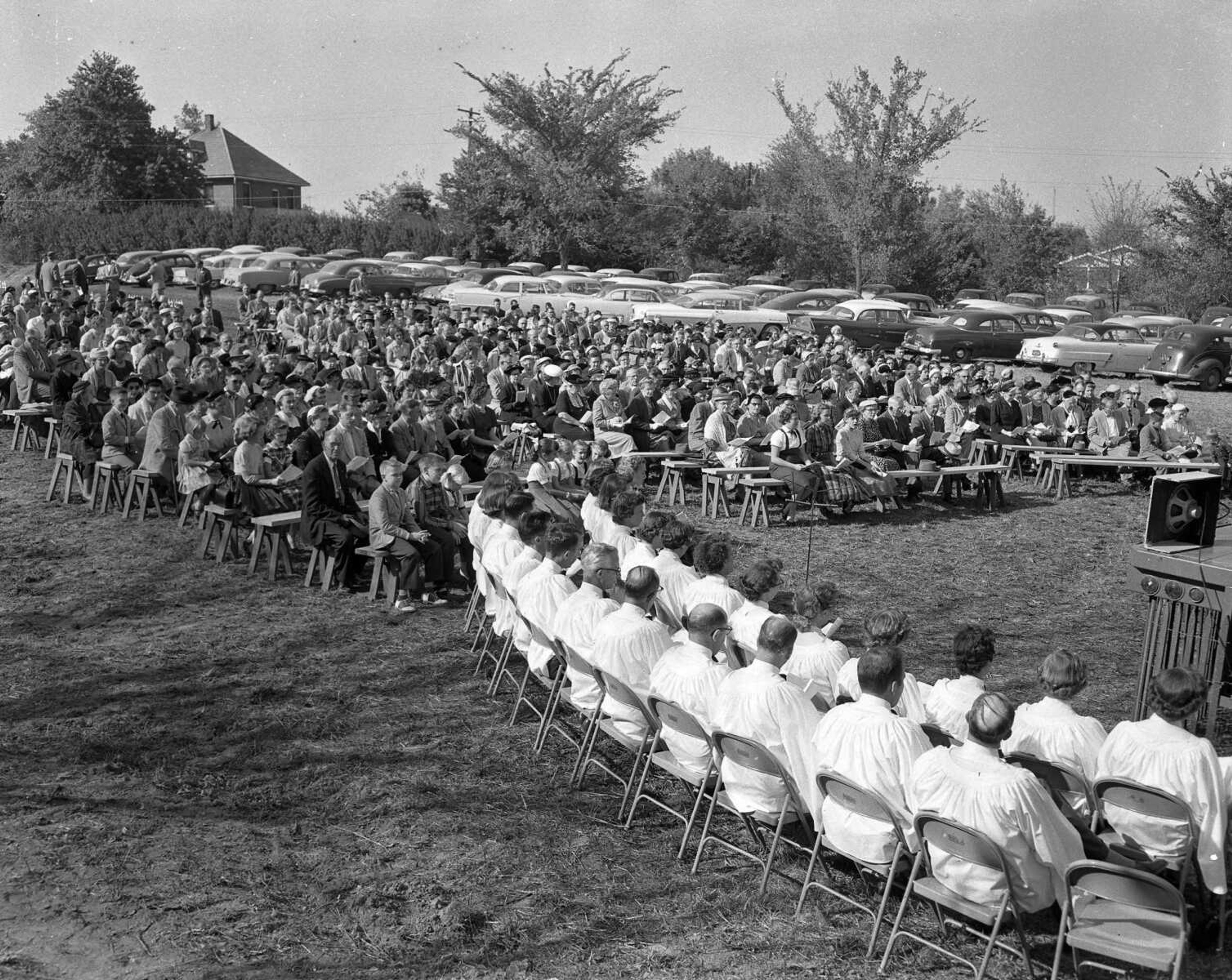 The first worship service of the new St. Andrew Lutheran Church was held Sunday, Oct. 6, 1957, at the church property on Kingsway. Approximately 650 attended the service including members of the new church and a number from Trinity congregation and churches throughout the district. In the foreground is the newly organized 30-voice choir which is under the direction of Mrs. C.A. Bohnsack.