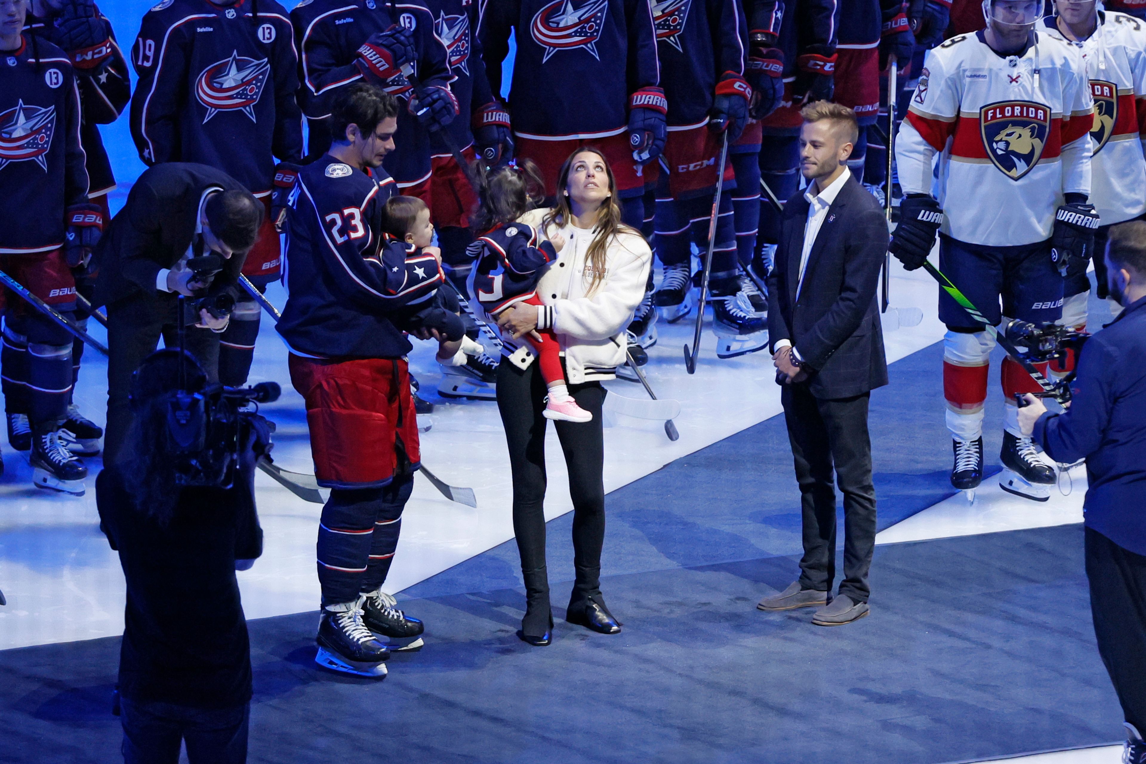 Blue Jackets' Johnny Gaudreau's family watches a #13 banner being raised during a ceremony before the start of an NHL hockey game between the Columbus Blue Jackets and the Florida Panthers. Tuesday, Oct. 15, 2024, in Columbus, Ohio. (AP Photo/Jay LaPrete)