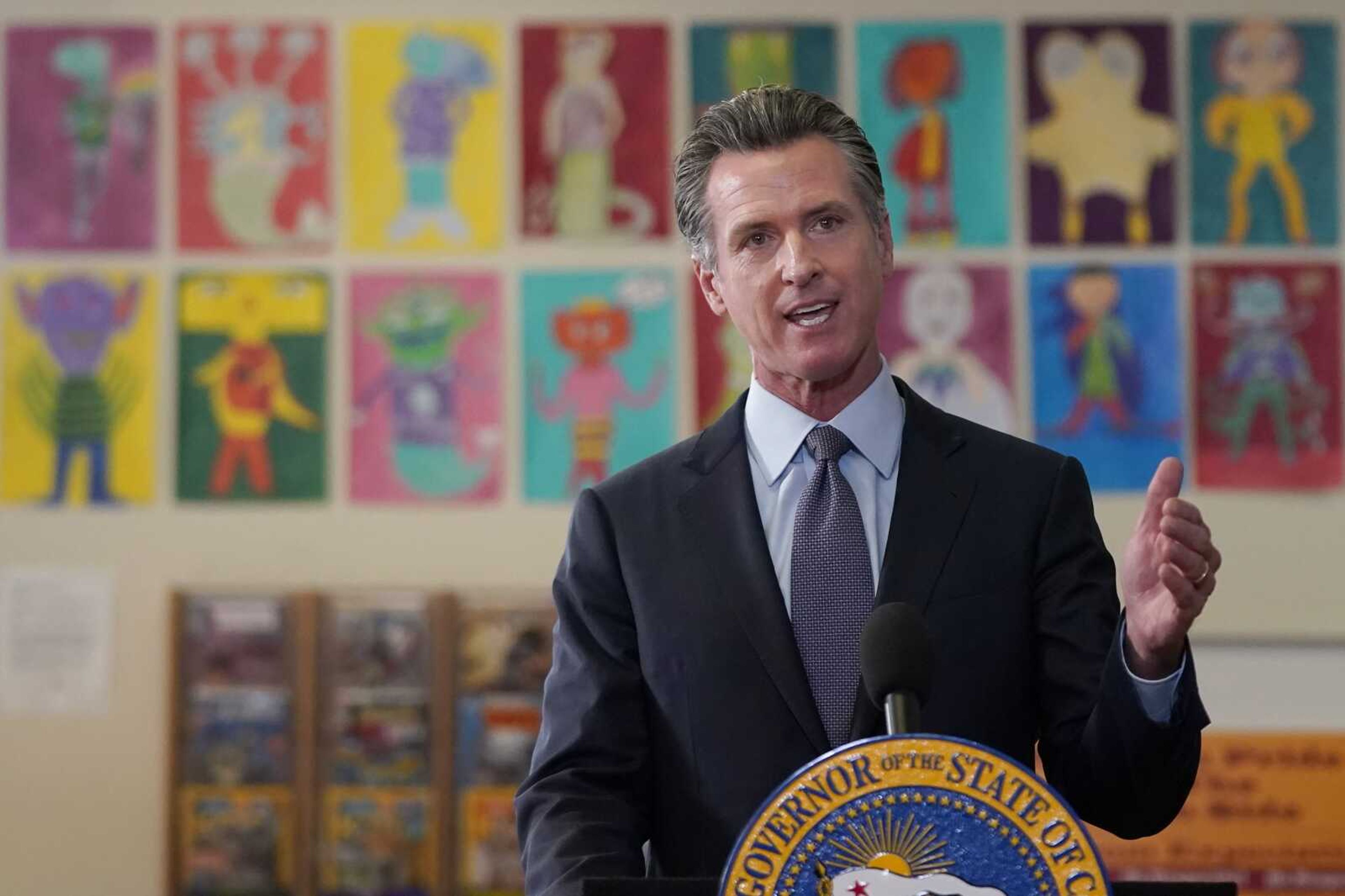 Gov. Gavin Newsom speaks at a news conference at James Denman Middle School in San Francisco, Friday, Oct. 1, 2021. California has announced the nation's first coronavirus vaccine mandate for schoolchildren.  Newsom said Friday that the mandate won t take effect until the COVID-19 vaccine has received final approval from the U.S. government for various grade levels.   (AP Photo/Jeff Chiu)