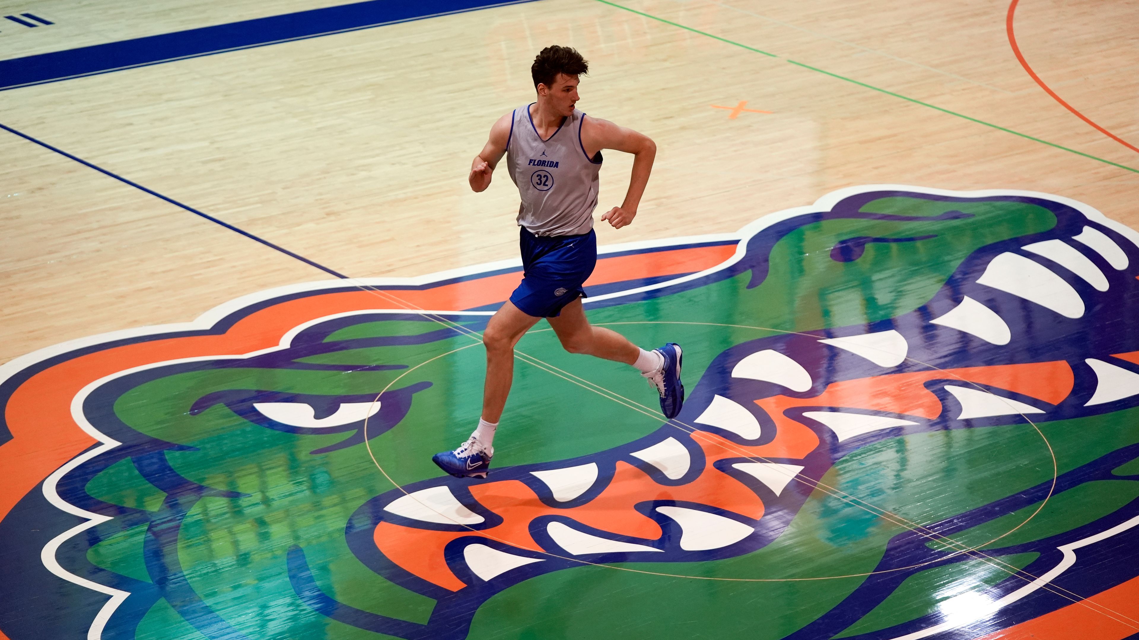 Olivier Rioux, 7-foot-9 NCAA college basketball player at Florida, runs the court at the team's practice, Friday, Oct. 18, 2024, in Gainesville, Fla. (AP Photo/John Raoux)