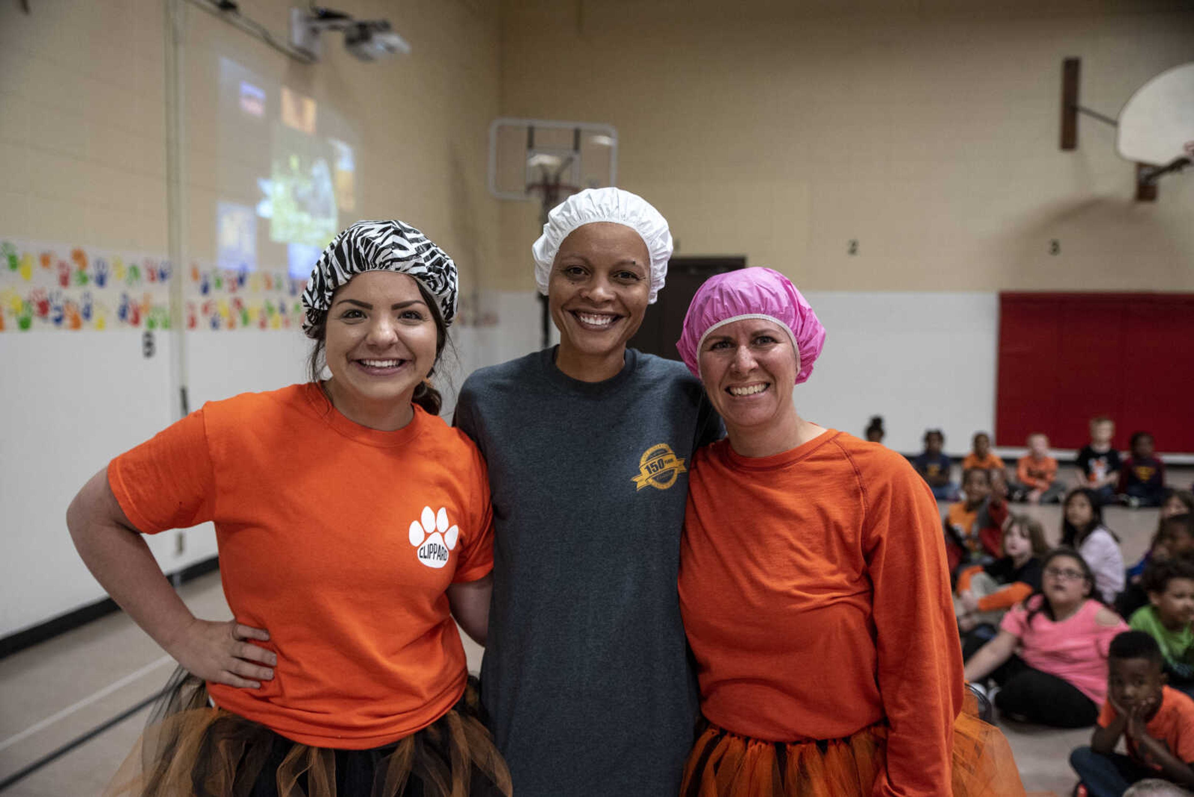 From left, Samantha Rose, Charity Owens and Amy Emmenderfer smile for a photo before being pied in the face by students at Clippard Elementary School Friday, April 5, 2019, in Cape Girardeau. Students earned votes for which teacher(s) would get pied in the face when they brought in donations to raise money for their end-of-the-year play day that is free to students. Through students and other donations, the school raised $550 towards their play day activities.