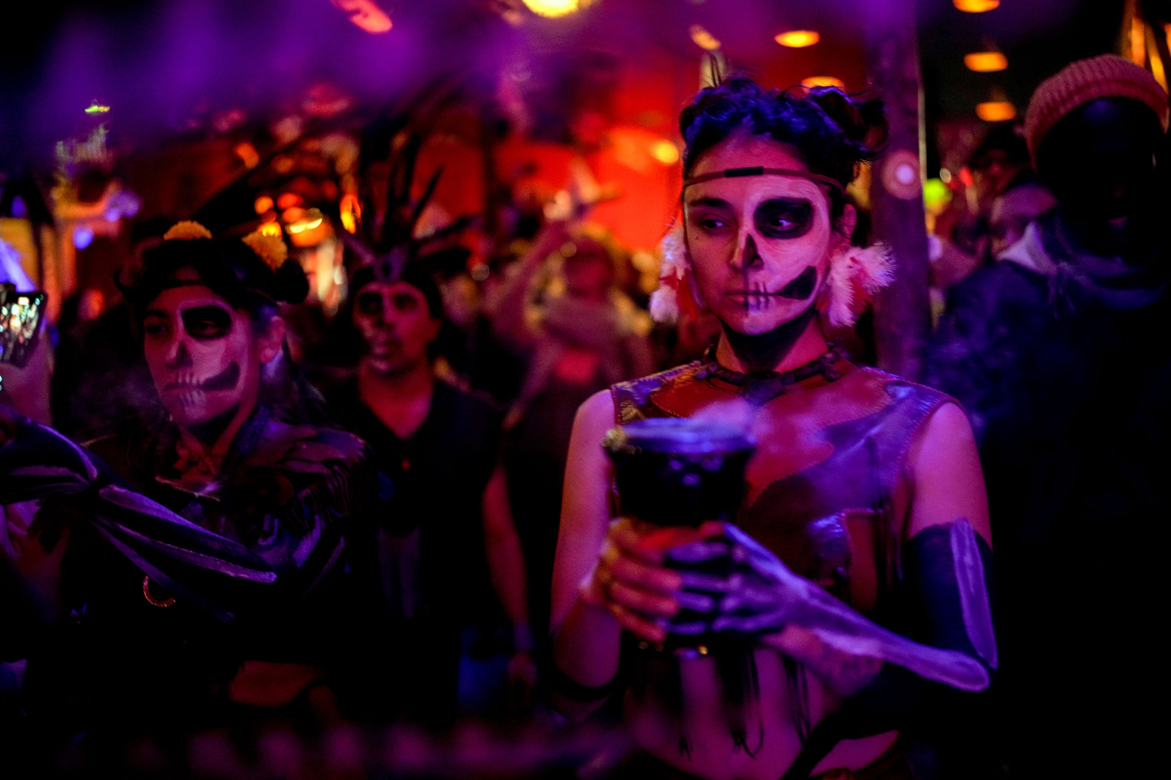 A Mexican Azteca dance group performs during the Day of the Dead ceremony in Berlin, Germany, Friday, Nov. 1, 2024. (AP Photo/Ebrahim Noroozi)