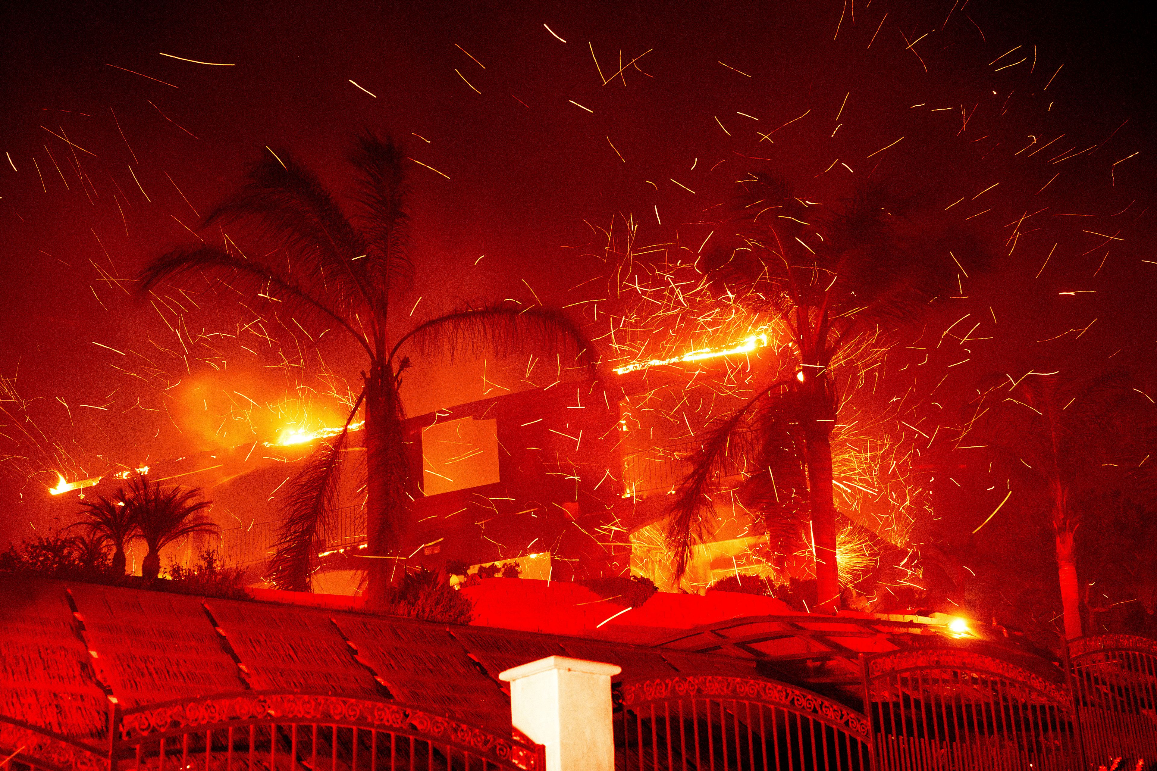 Flames consume a home as the Mountain Fire burns in Camarillo, Calif., on Wednesday, Nov. 6, 2024. (AP Photo/Noah Berger)