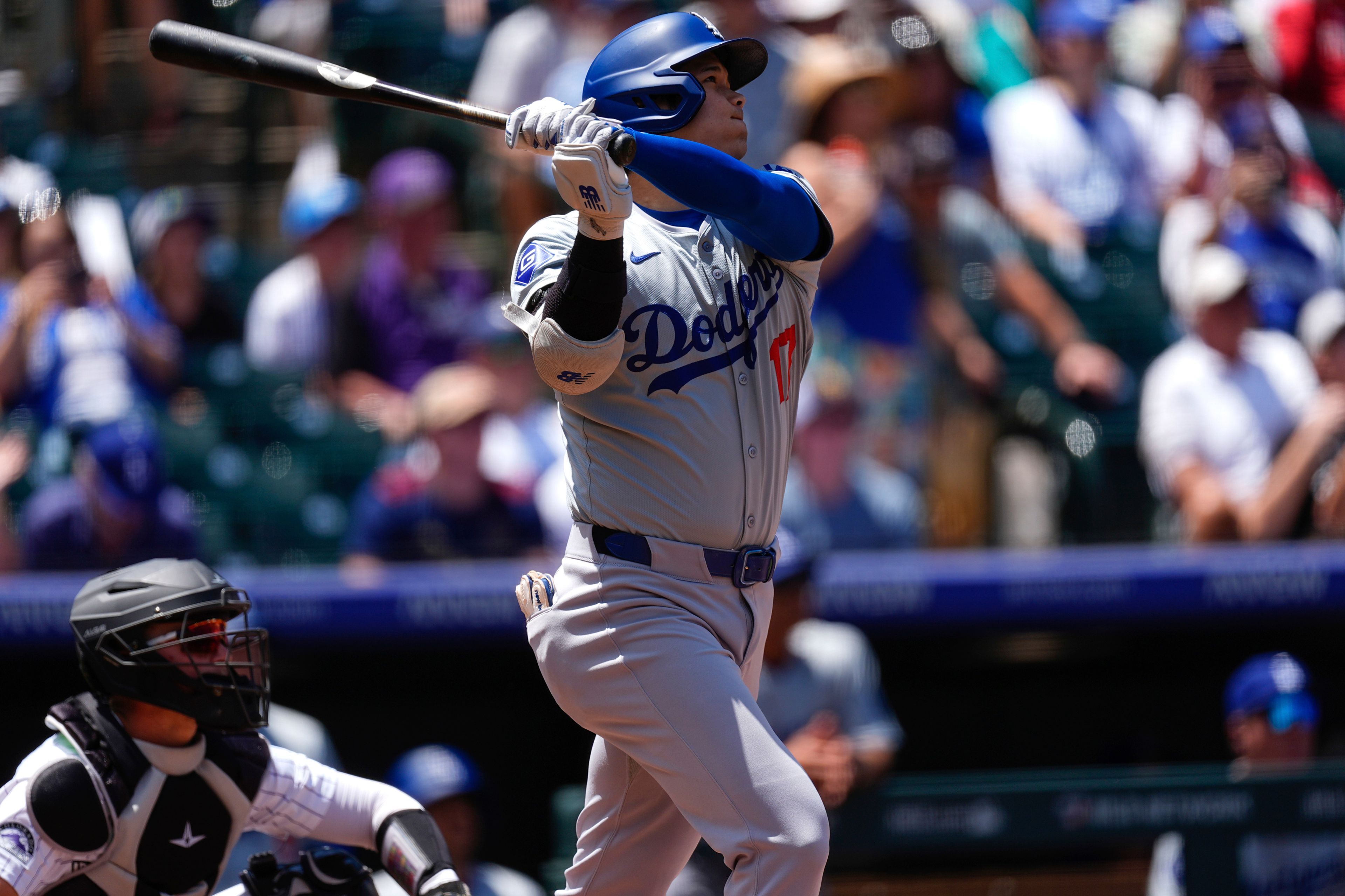 Los Angeles Dodgers' Shohei Ohtani hits a solo home run off Colorado Rockies starting pitcher Ty Blach in the first inning of baseball game Thursday, June 20, 2024, in Denver. (AP Photo/David Zalubowski)