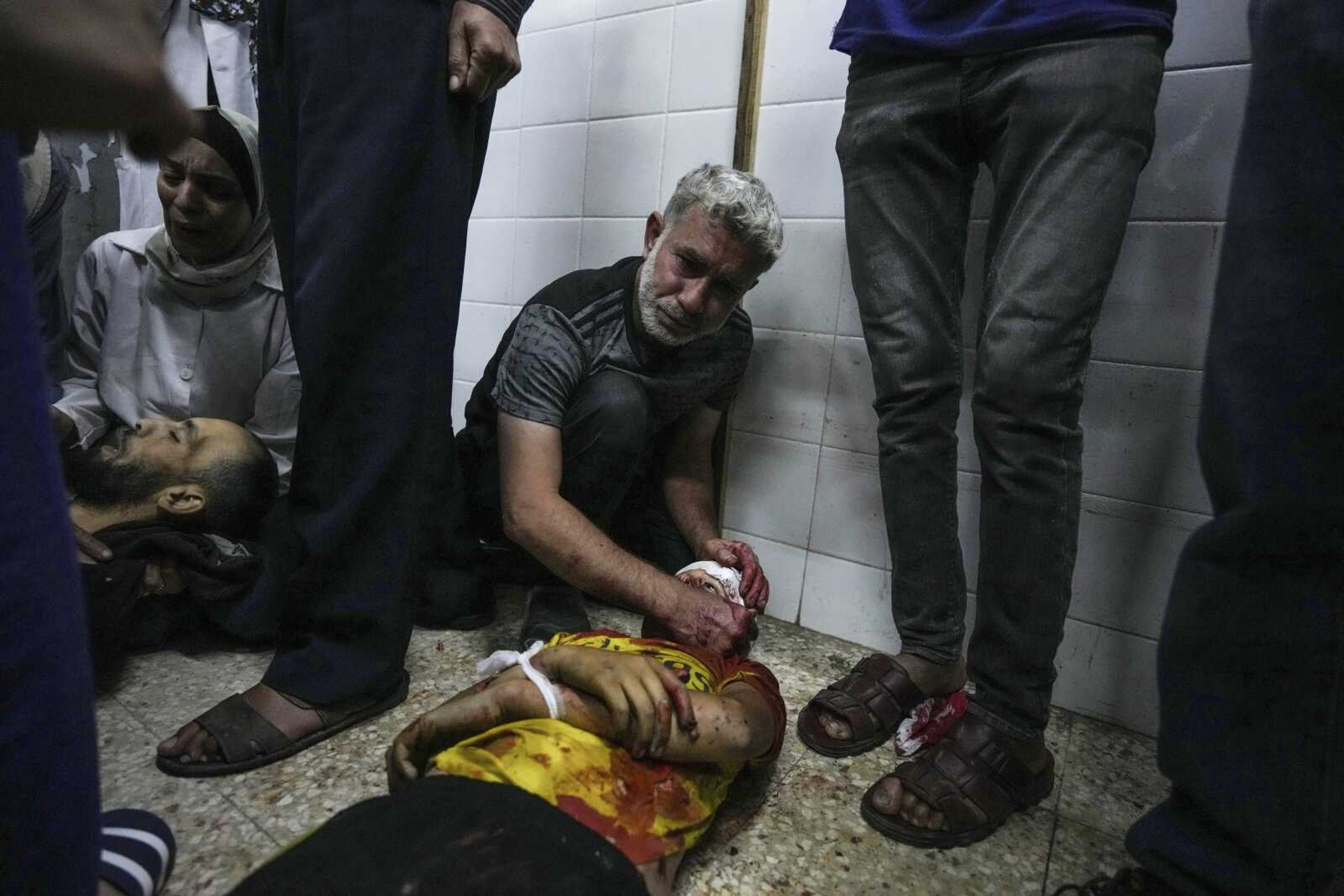 Palestinians mourn their relatives killed in the Israeli bombardment of the Gaza Strip, at the Al Aqsa hospital in Deir al Balah, Gaza, Thursday, May 9, 2024. (AP Photo/Abdel Kareem Hana)