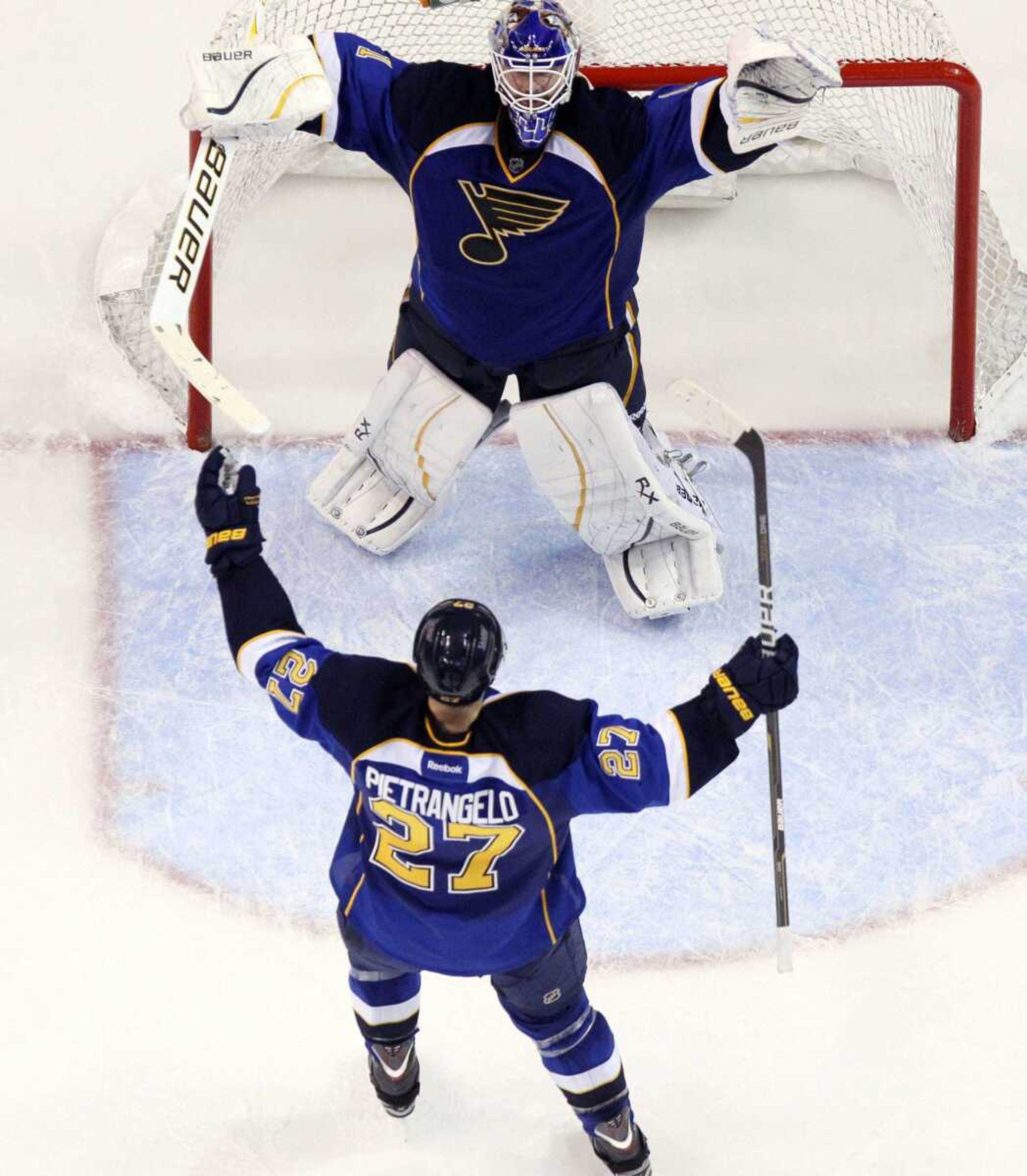 Blues defenseman Alex Pietrangelo celebrates with goaltender Brian Elliott as time expires in Game 5 of their first-round playoff series Saturday in St. Louis. The Blues won the game 3-1 to win the series 4-1. (CHRIS LEE ~ St. Louis Post-Dispatch)