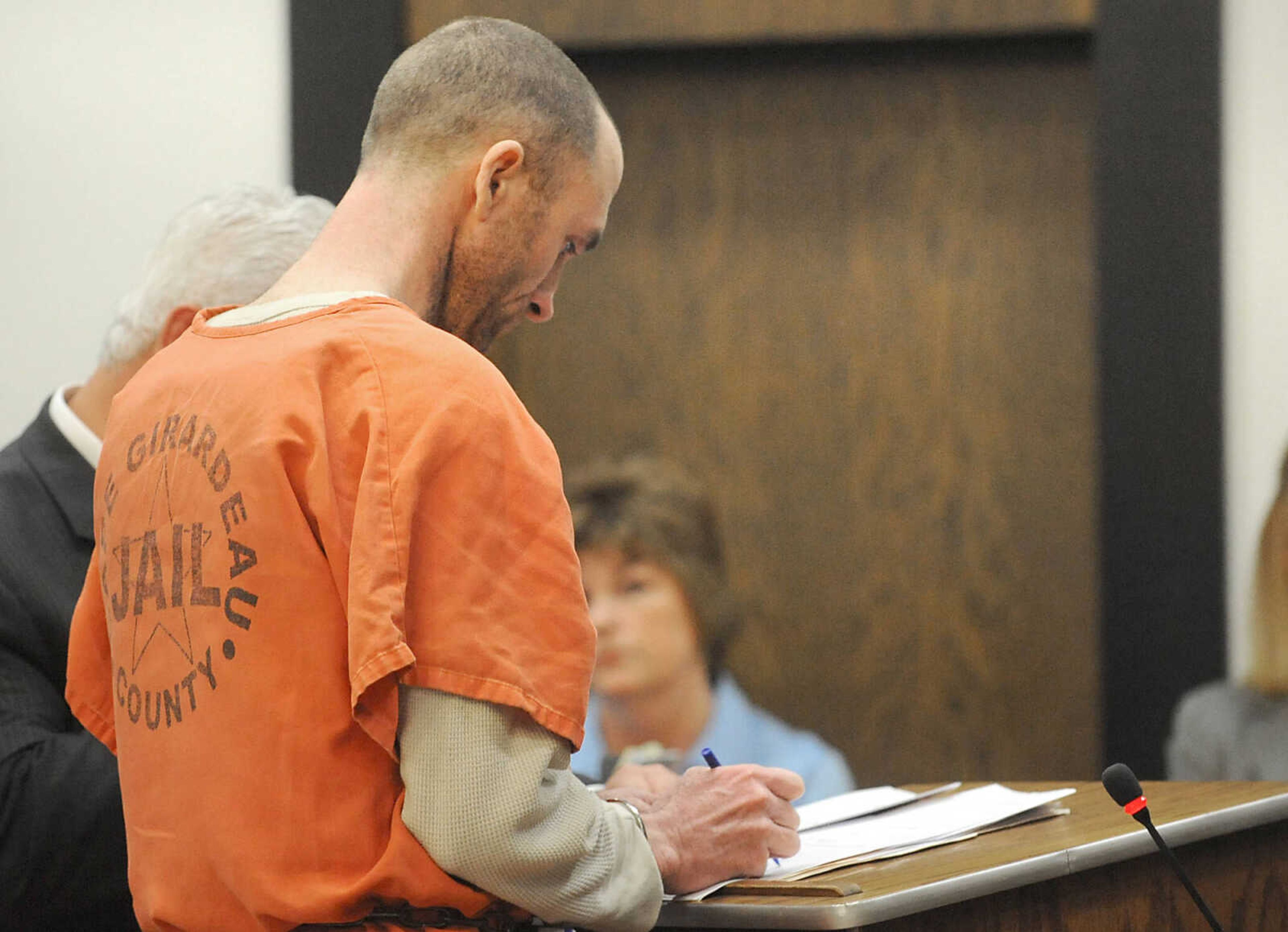 LAURA SIMON ~ lsimon@semissourian.com 
Clay Waller signs his plea agreement Thursday, June 6, 2013, at the Cape Girardeau County Courthouse. Waller pleaded guilty to second-degree murder for the death of his wife, Jacque Waller. Jacque Waller went missing June 1, 2011. Her body was found last Wednesday in Southern Illinois.