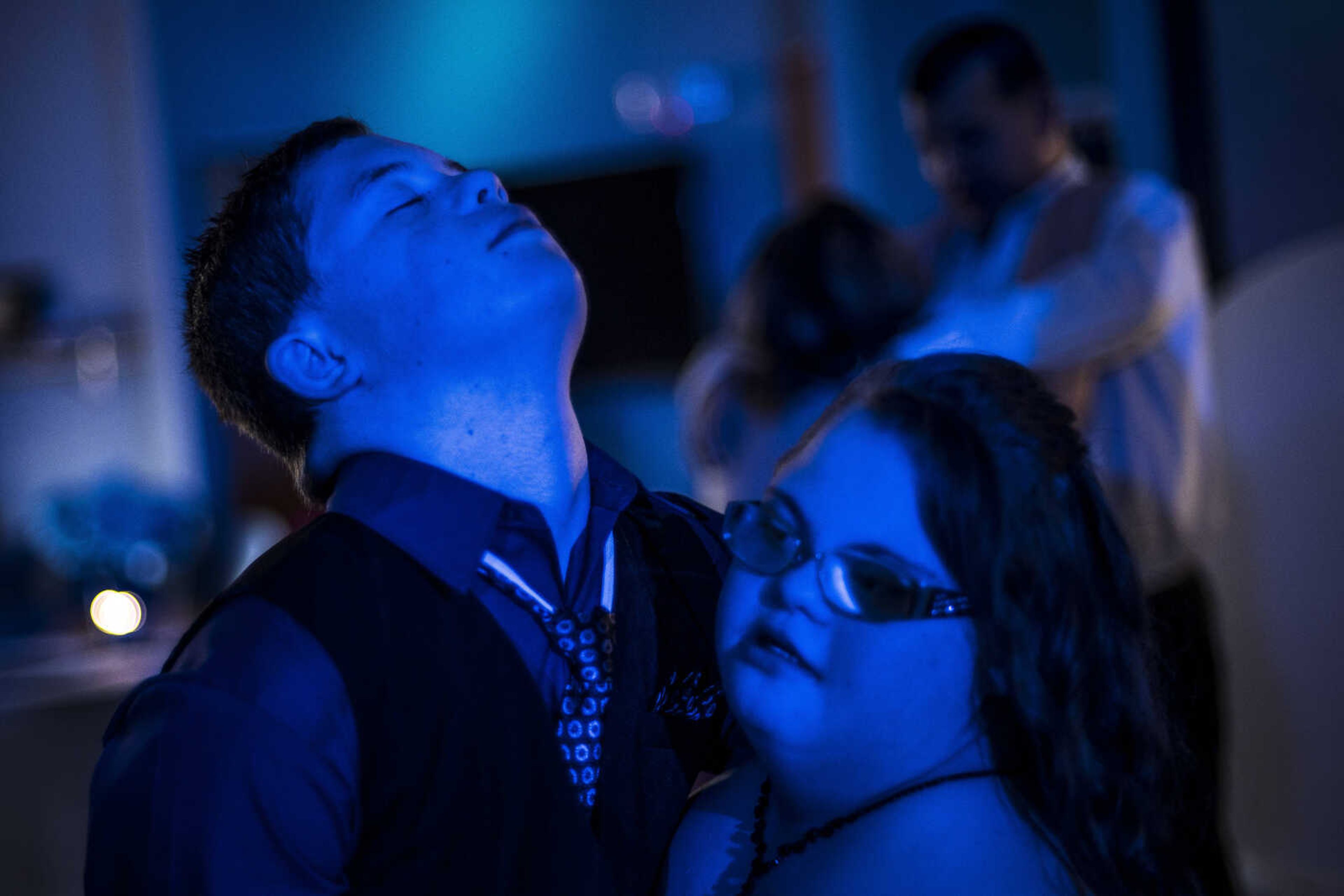 Preston Forest, 13, dances with Emily Crider, also 13, during the Blue Light Ball Friday, April 12, 2019, at SEMO Alliance for Disability Independence, Inc. in Cape Girardeau.