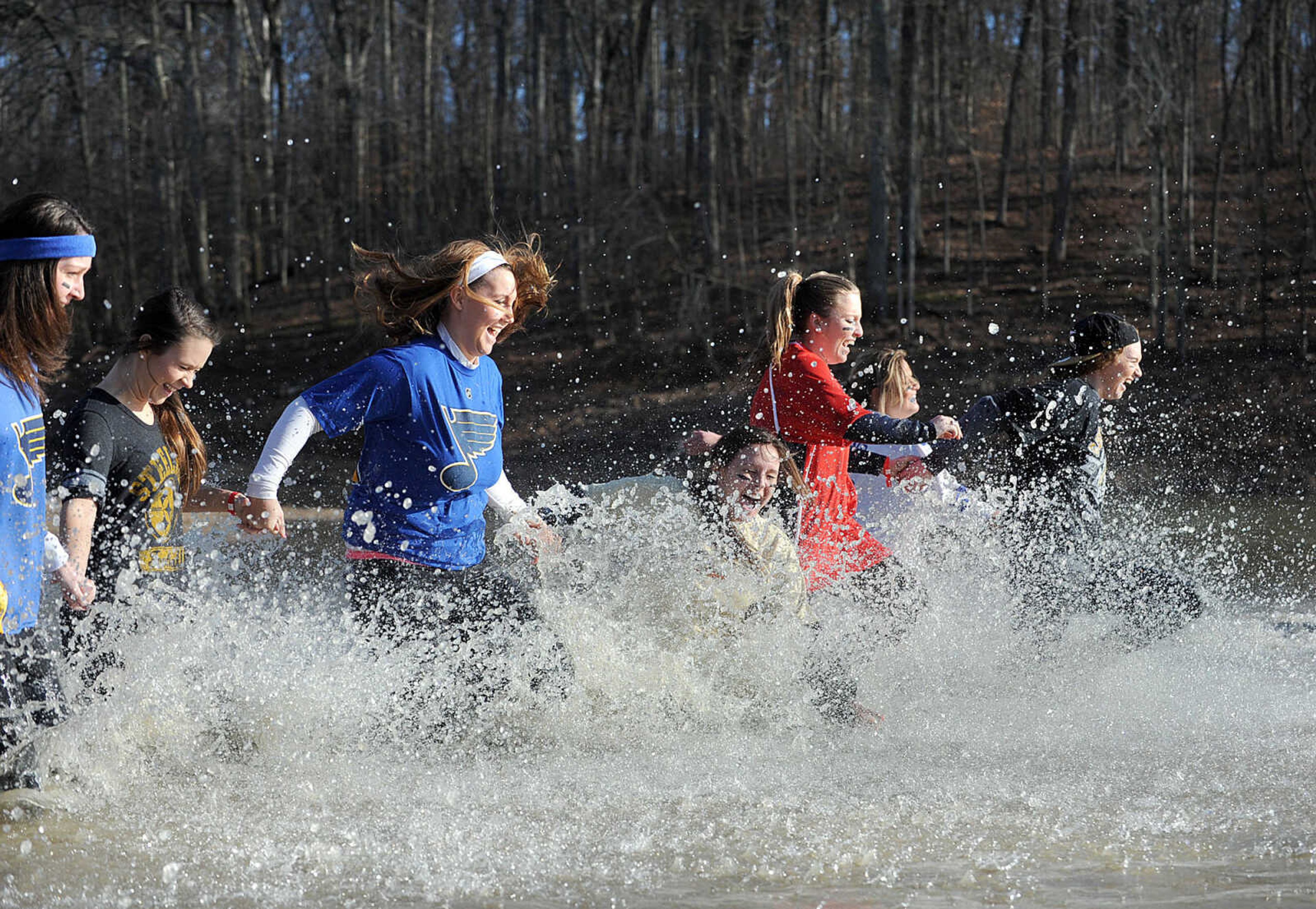 LAURA SIMON ~ lsimon@semissourian.com
People plunge into the cold waters of Lake Boutin Saturday afternoon, Feb. 2, 2013 during the Polar Plunge at Trail of Tears State Park. Thirty-six teams totaling 291 people took the annual plunge that benefits Special Olympics Missouri.