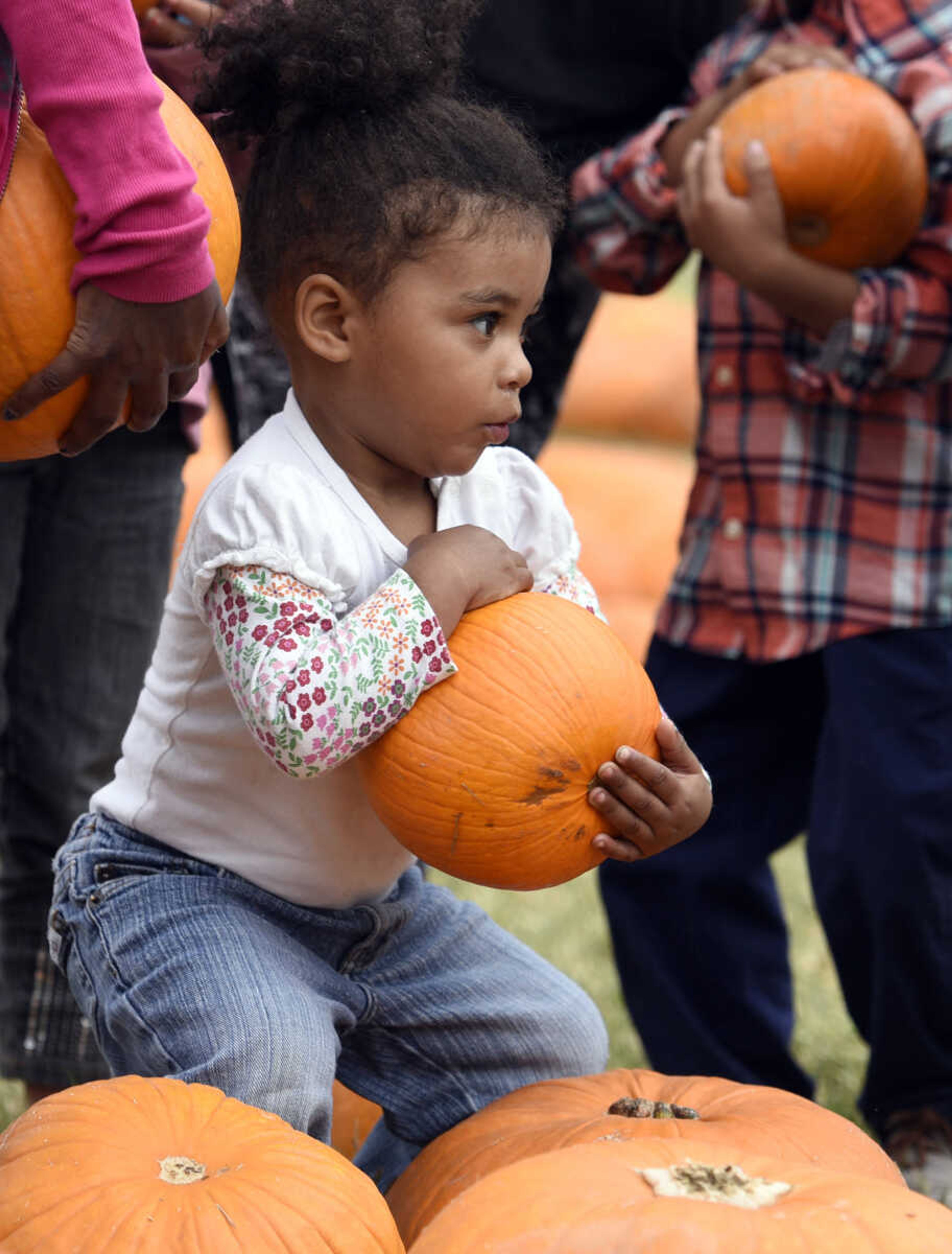 LAURA SIMON ~ lsimon@semissourian.com

Za'Kaylah Espinoza picks out her pumpkin at the Grace United Methodist Church pumpkin patch on Wednesday, Oct. 12, 2016 in Cape Girardeau.