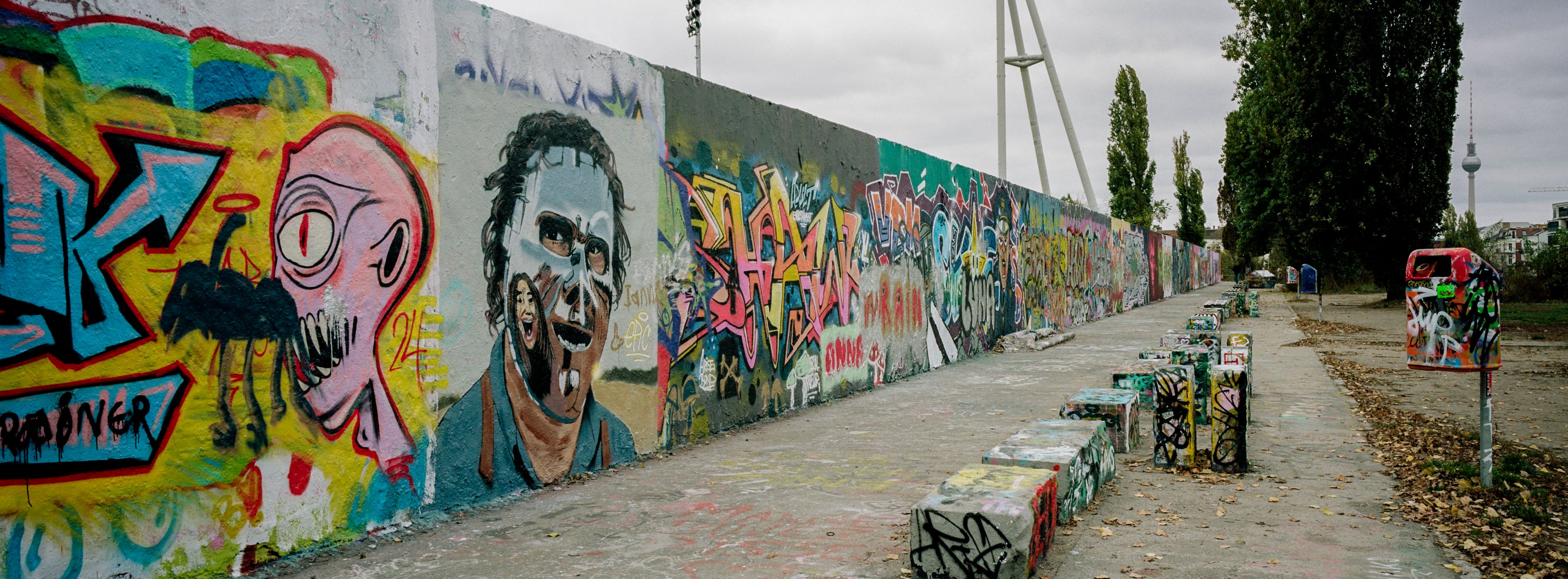 Remains of the former Berlin Wall are covered with graffiti at the Mauerpark (Wall Park) in Berlin, Germany, Thursday, Oct. 31, 2024. (AP Photo/Markus Schreiber)