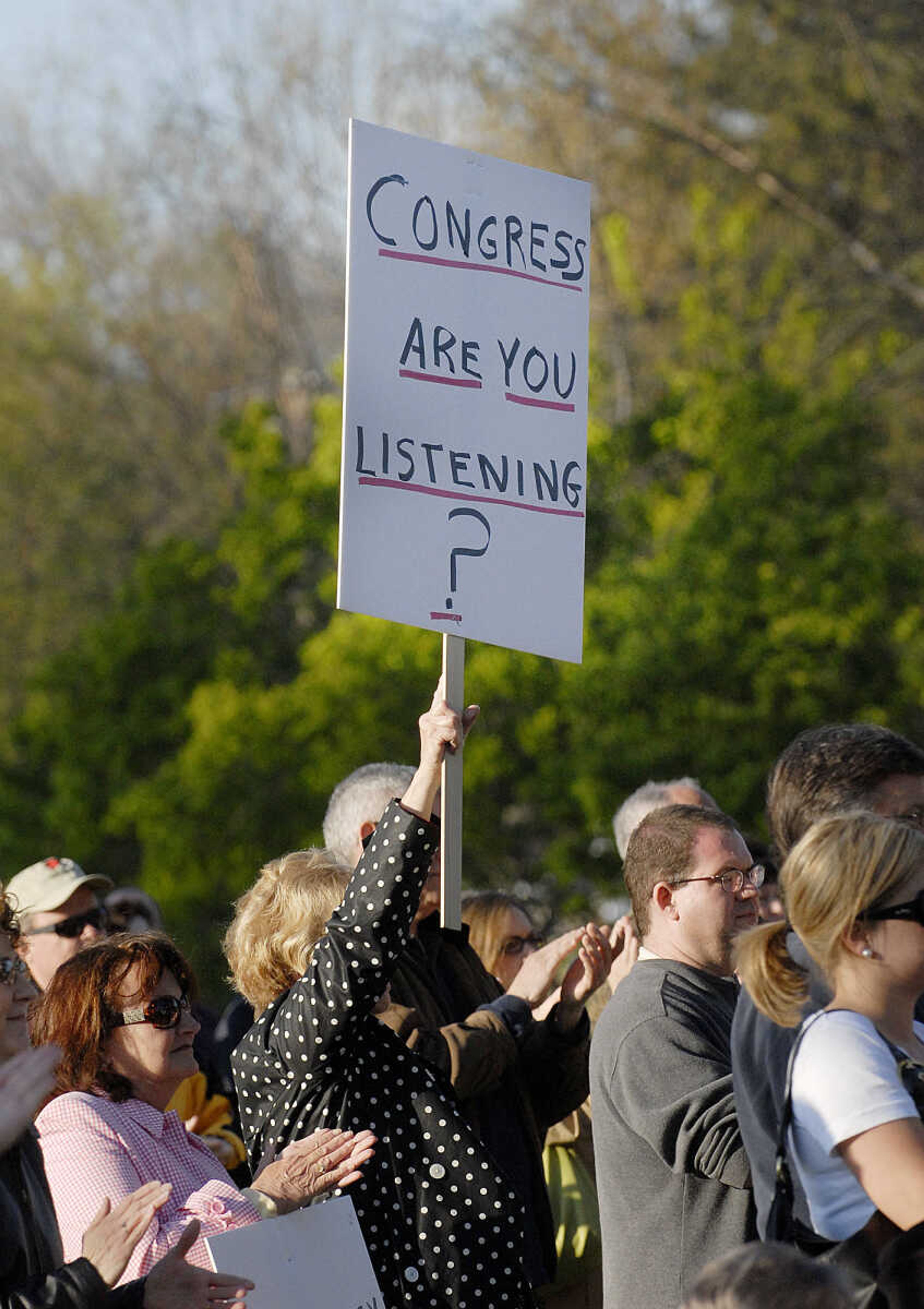 ELIZABETH DODD ~ edodd@semissourian.com
A crowd of 600 cheer with speakers airing their grievances at "tea party" tax protest April 15 at Capaha Park.