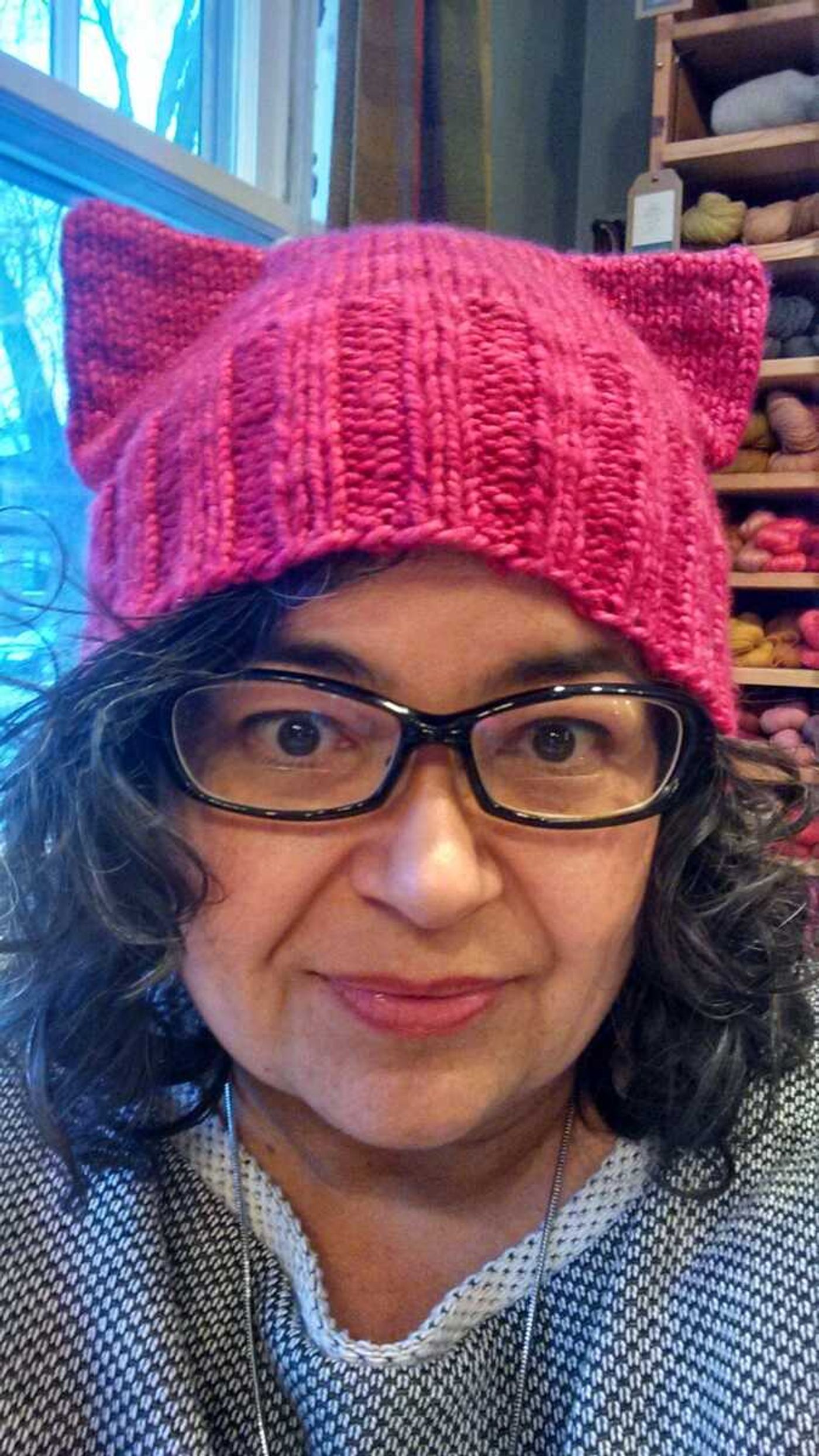 Angie Paulson, a knitter who works at The Yarnery shop in Saint Paul, Minnesota, displays one of the "pussy" hats she made.