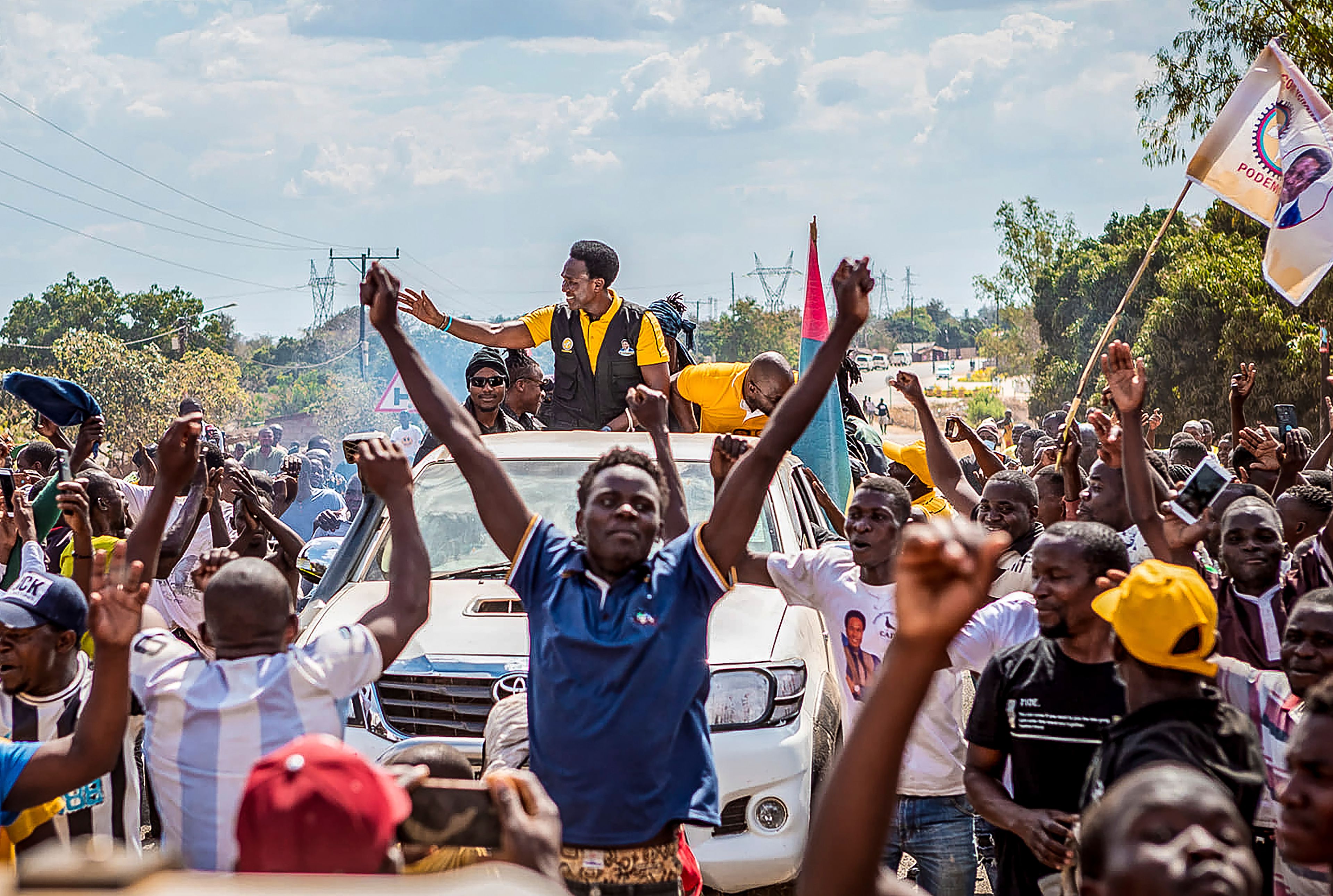 Independent candidate Venacio Mondlane, atop truck, attends an election rally in Maputo, Sunday, Oct. 6, 2024 ahead of elections to be held in Mozambique. (AP Photo/Carlos Uqueio)