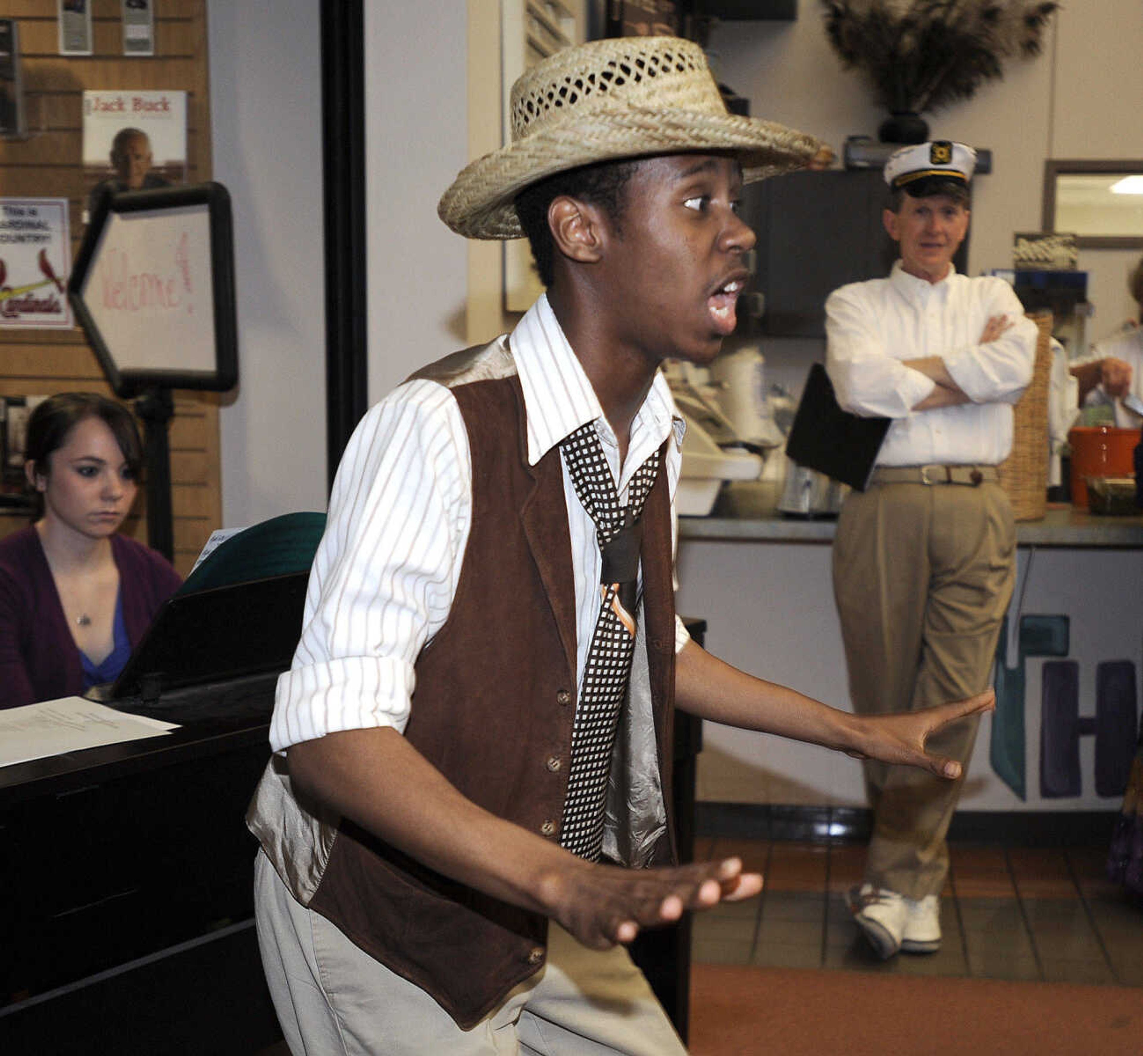 FRED LYNCH ~ flynch@semissourian.com
Quitman McBride III sings "Sit Down, You're Rockin' the Boat!" during the Mark Twain Centennial event Tuesday at Central High School.