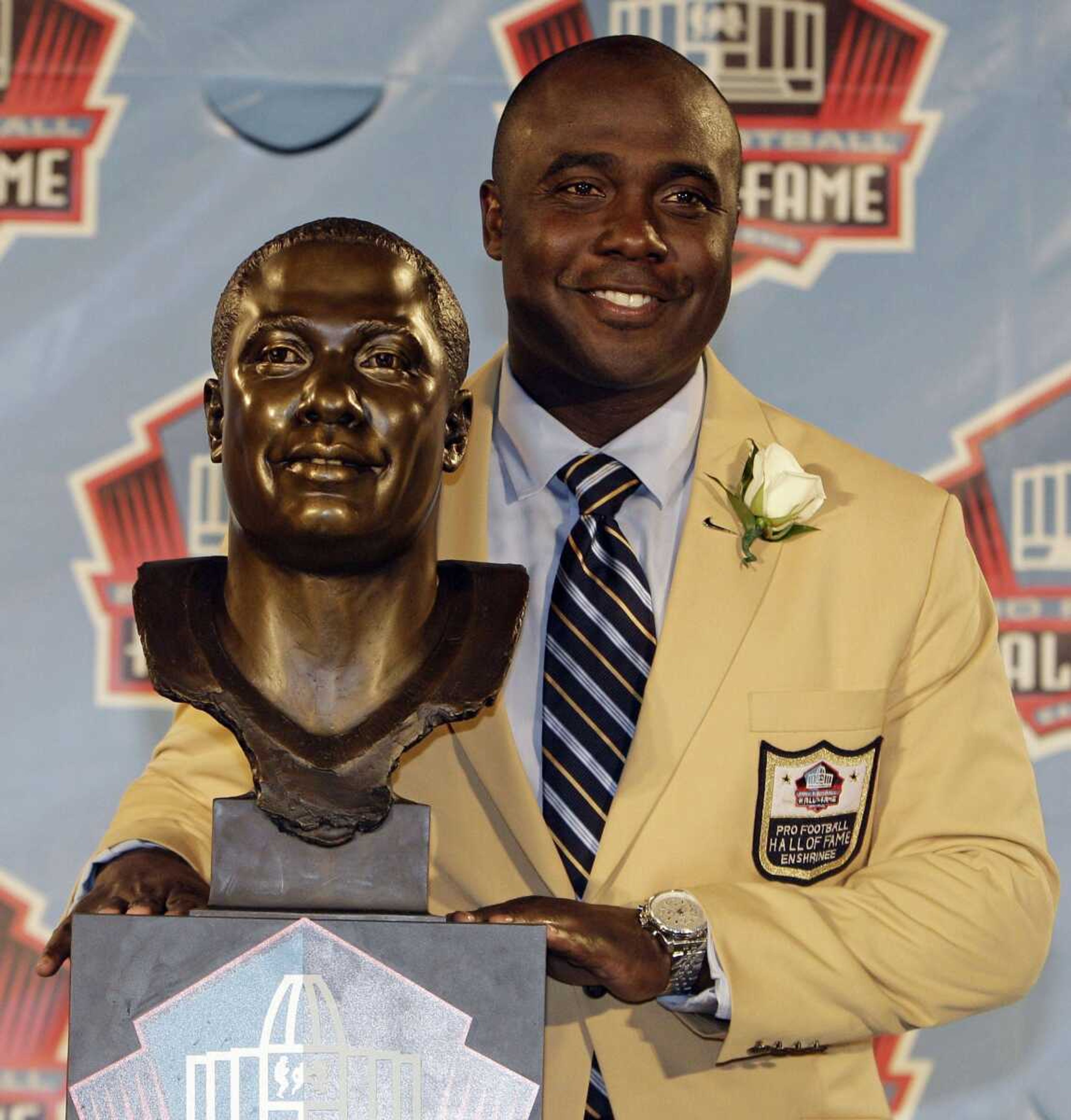 Marshall Faulk poses with a bust of himself Saturday during the induction ceremony at the Pro Football Hall of Fame in Canton, Ohio. (TONY DEJAK ~ Associated Press)