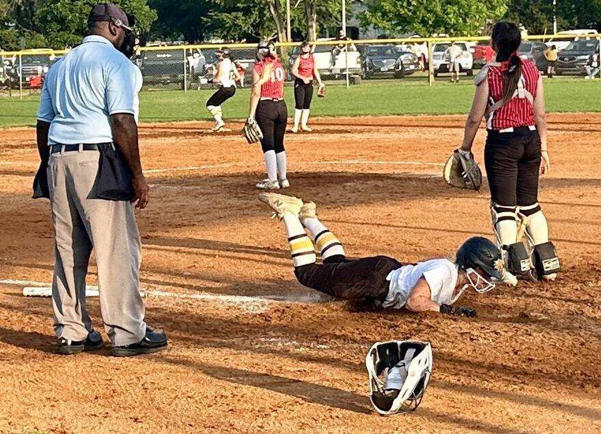 Kennett Lady Indian Hadley Wilson comes in hot across home plate Tuesday at Malden.