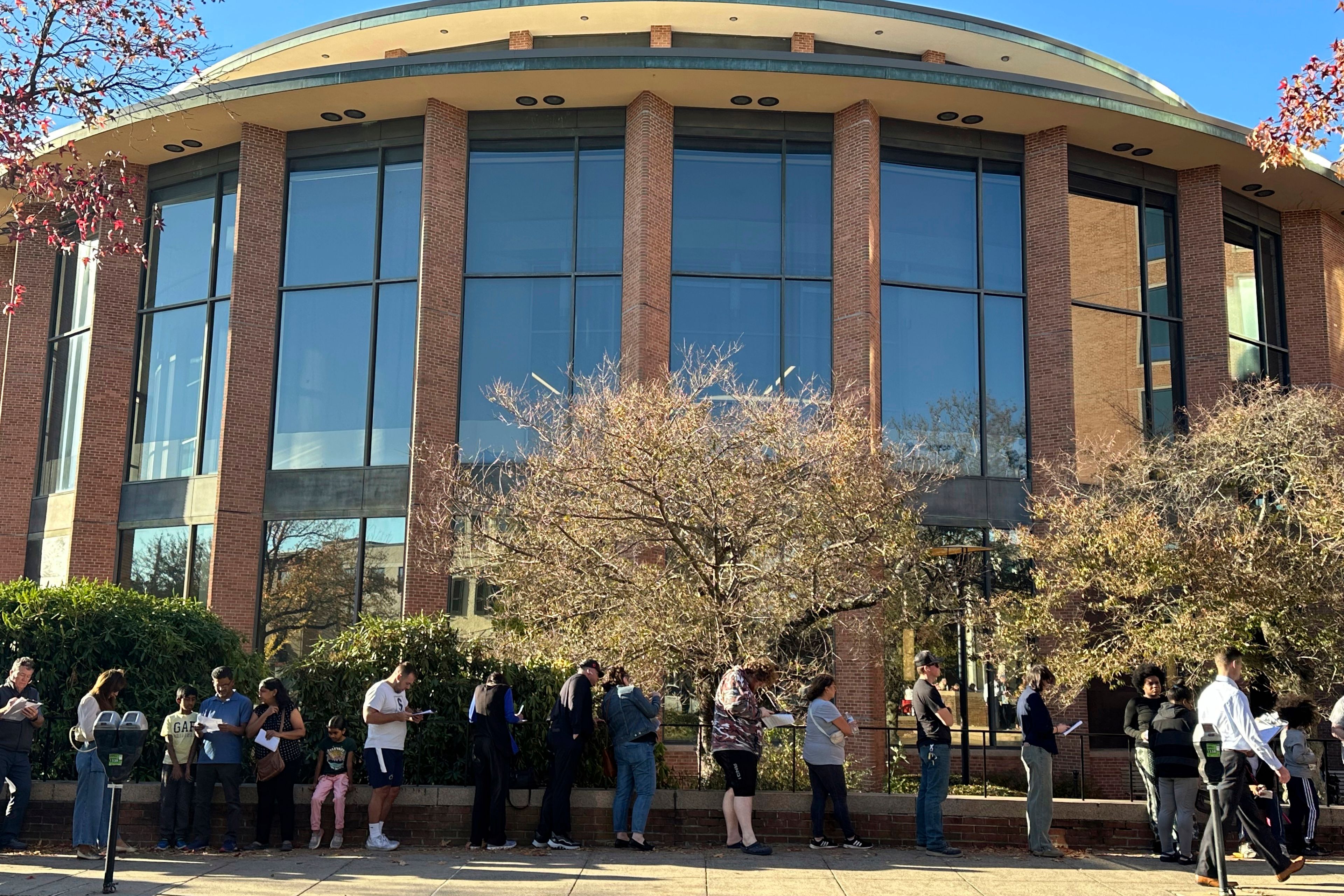 Voters line up outside the Bucks County Administration Building during early voting in the general election, Friday, Nov. 1, 2024, in Doylestown, Pa. (AP Photo/Michael Rubinkam)