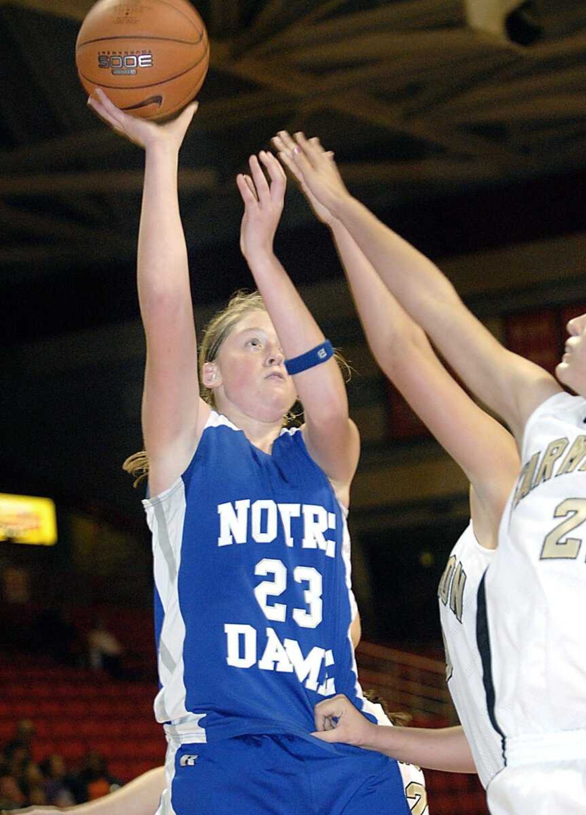 Notre Dame's Jane Morrill (23) shot over several Farmington defenders Friday night, December 21, 2007, in the championship game of the St. Francis Medical Center Holiday Classic at the Show Me Center. (Kit Doyle)