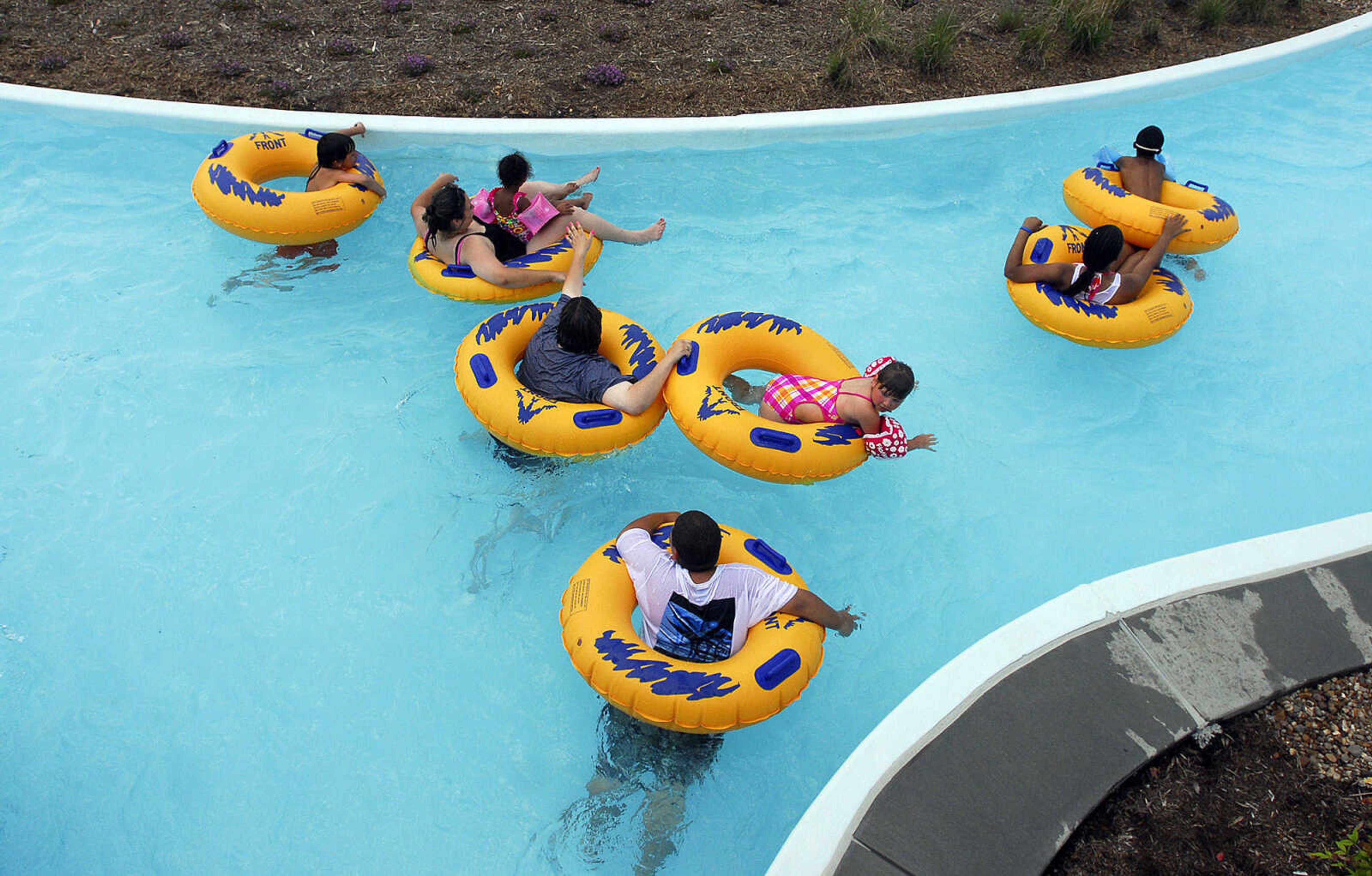 LAURA SIMON~lsimon@semissourian.com
People float along the lazy river on inner tubes Saturday, May 29, 2010 during the opening day of Cape Splash Family Auquatic Center.