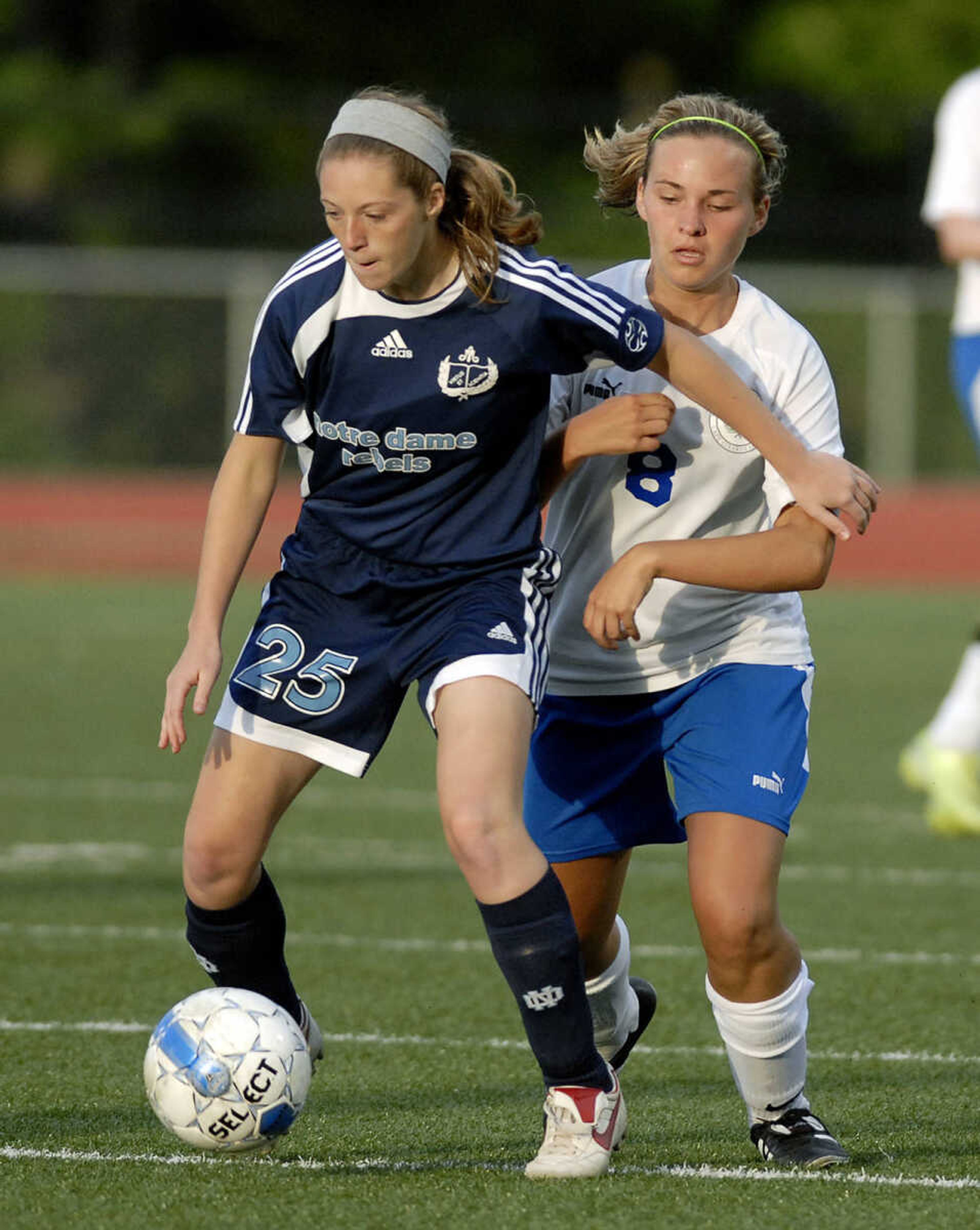 ELIZABETH DODD ~ edodd@semissourian.com
Notre Dame St Louis' Devin Dreste, left, attempts to keep the ball from Notre Dame's Molly Proffer in the second half of the Class 2 quarterfinals game Thursday at Hillsboro.