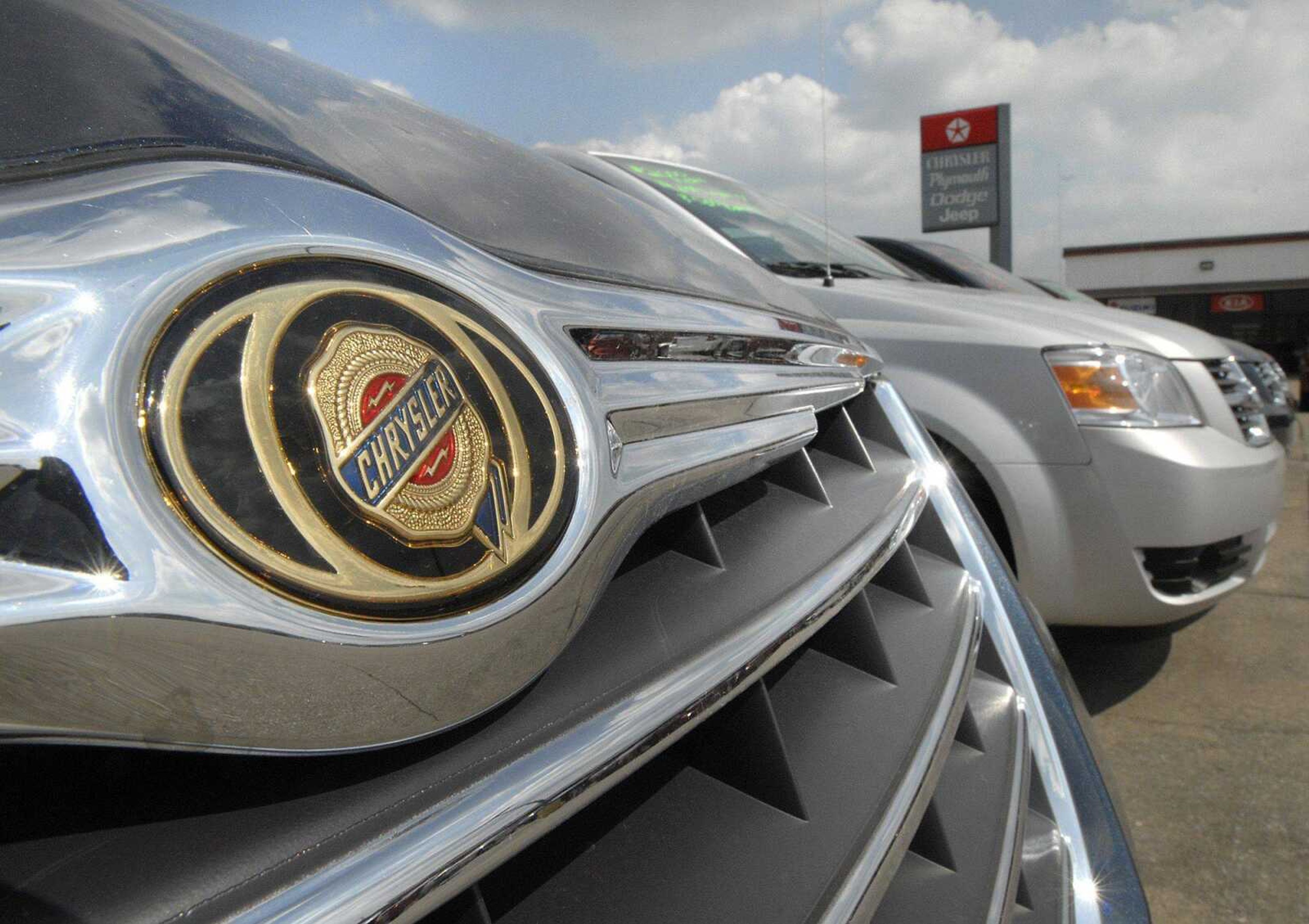 Chrysler and Dodge minivans await customers at Auffenberg Chrysler Dodge Jeep in Cape Girardeau. (Fred Lynch)