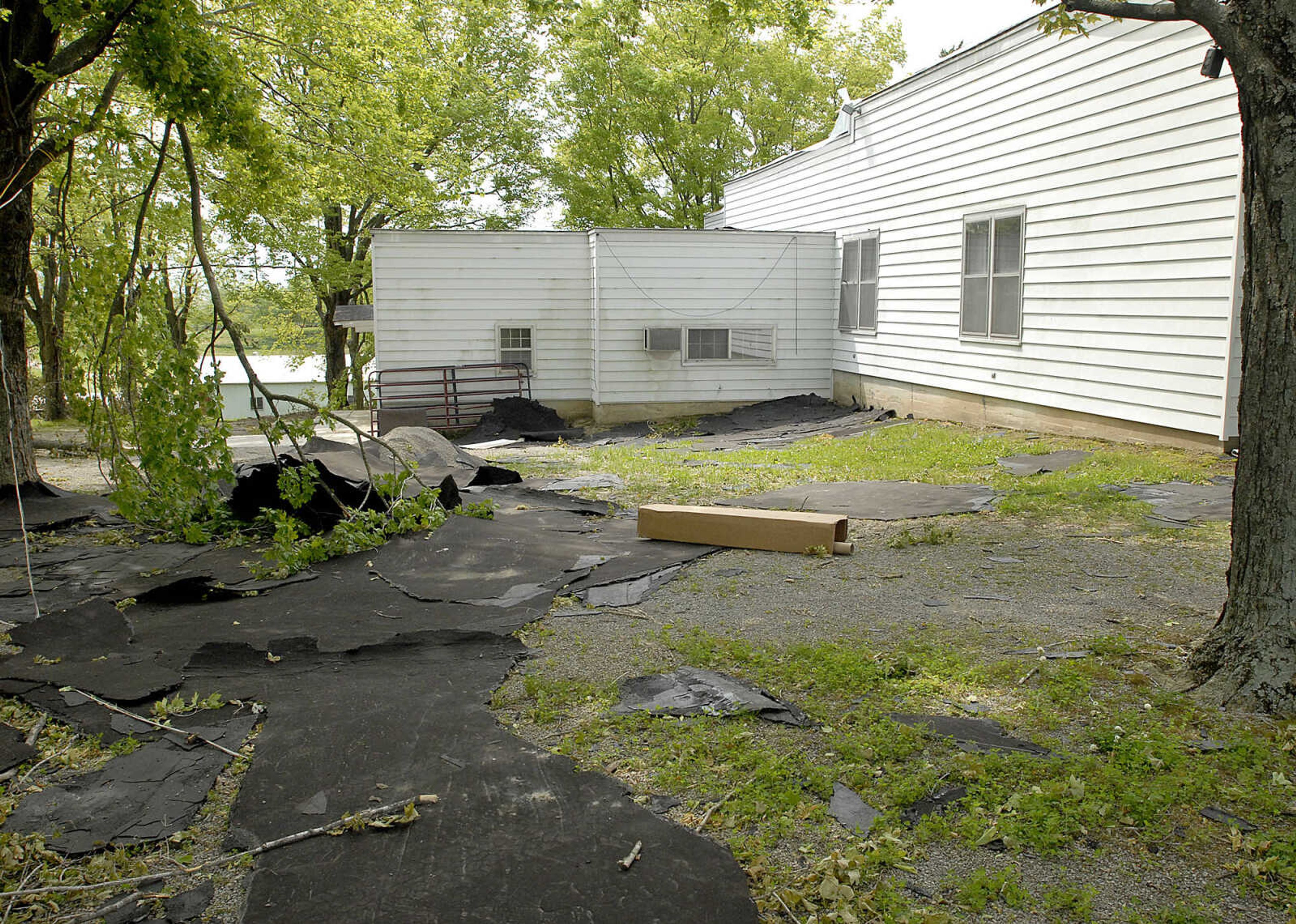 ELIZABETH DODD ~ edodd@semissourian.com
Piles roof belonging to the senior center on Church Street in Altenburg lay on the ground that was blown off during the May 8 storms.