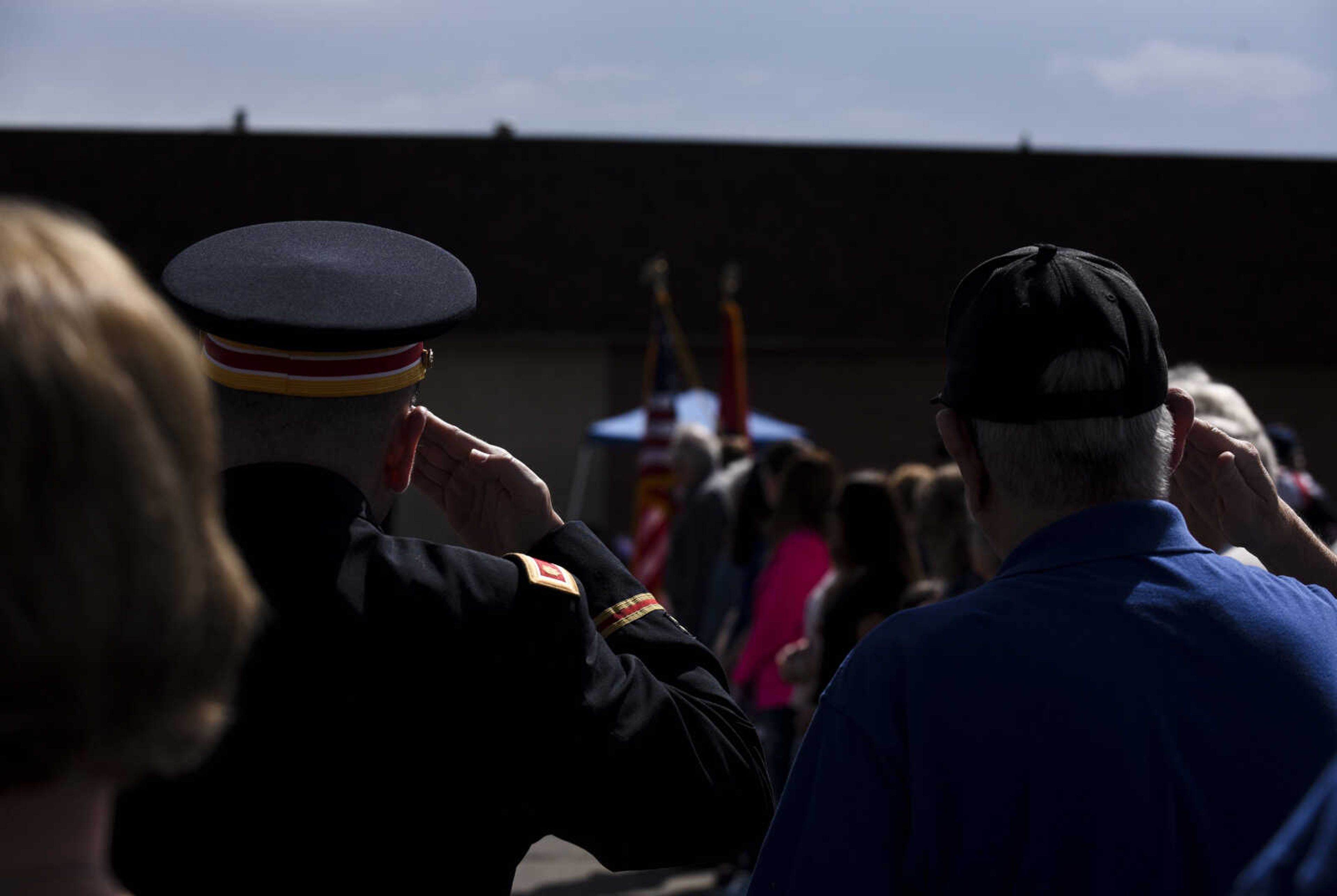 Veterans salute the flags as Scout Pack 220 posts the colors at the Honoring our Military event Saturday, May 5, 2018, at the Scott City Historical Museum in Scott City.