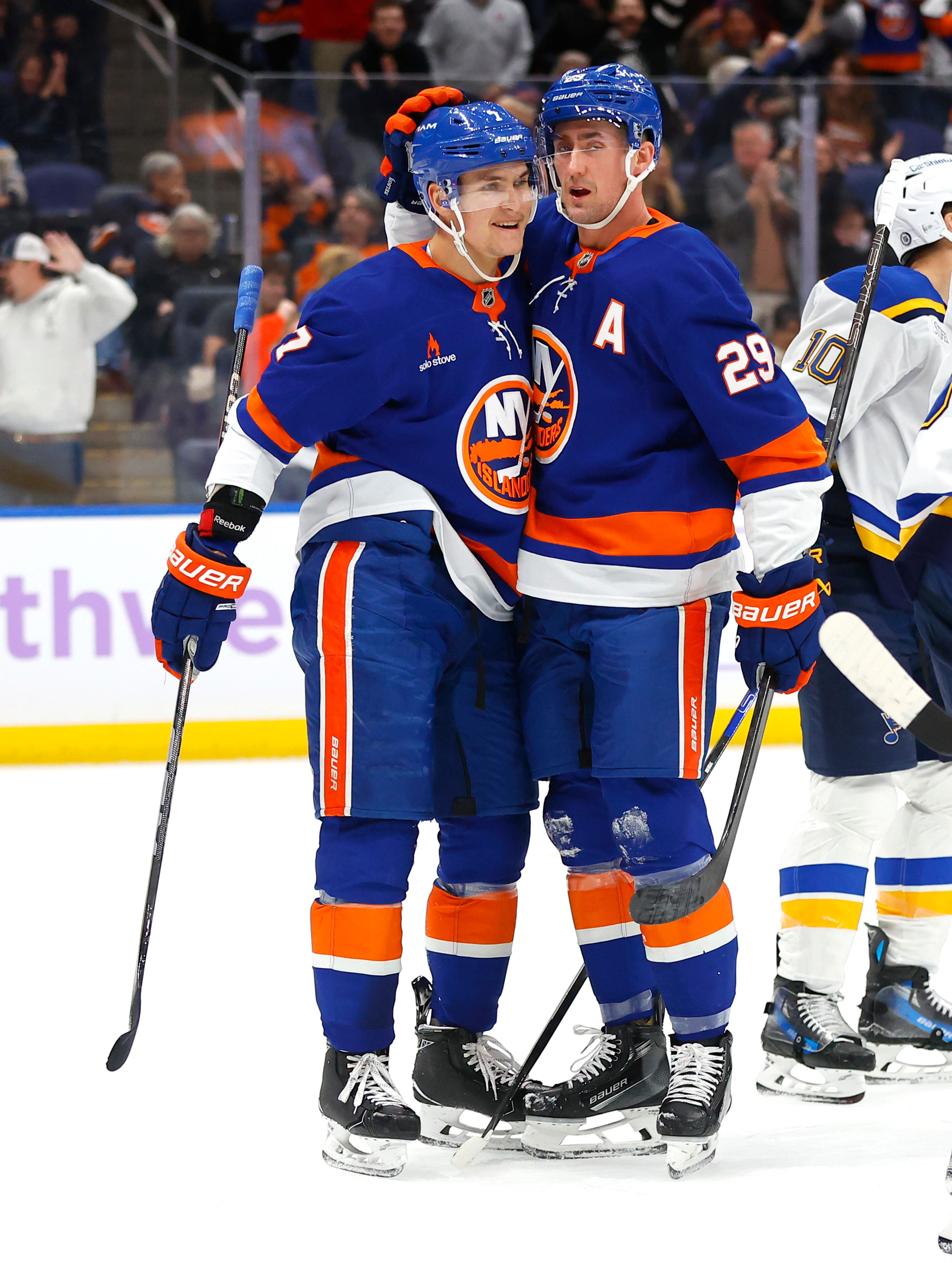 New York Islanders center Brock Nelson (29) celebrates with right wing Maxim Tsyplakov (7) after scoring a goal against the St. Louis Blues during the second period of an NHL hockey game, Saturday, Nov. 23, 2024, in New York. (AP Photo/Noah K. Murray)