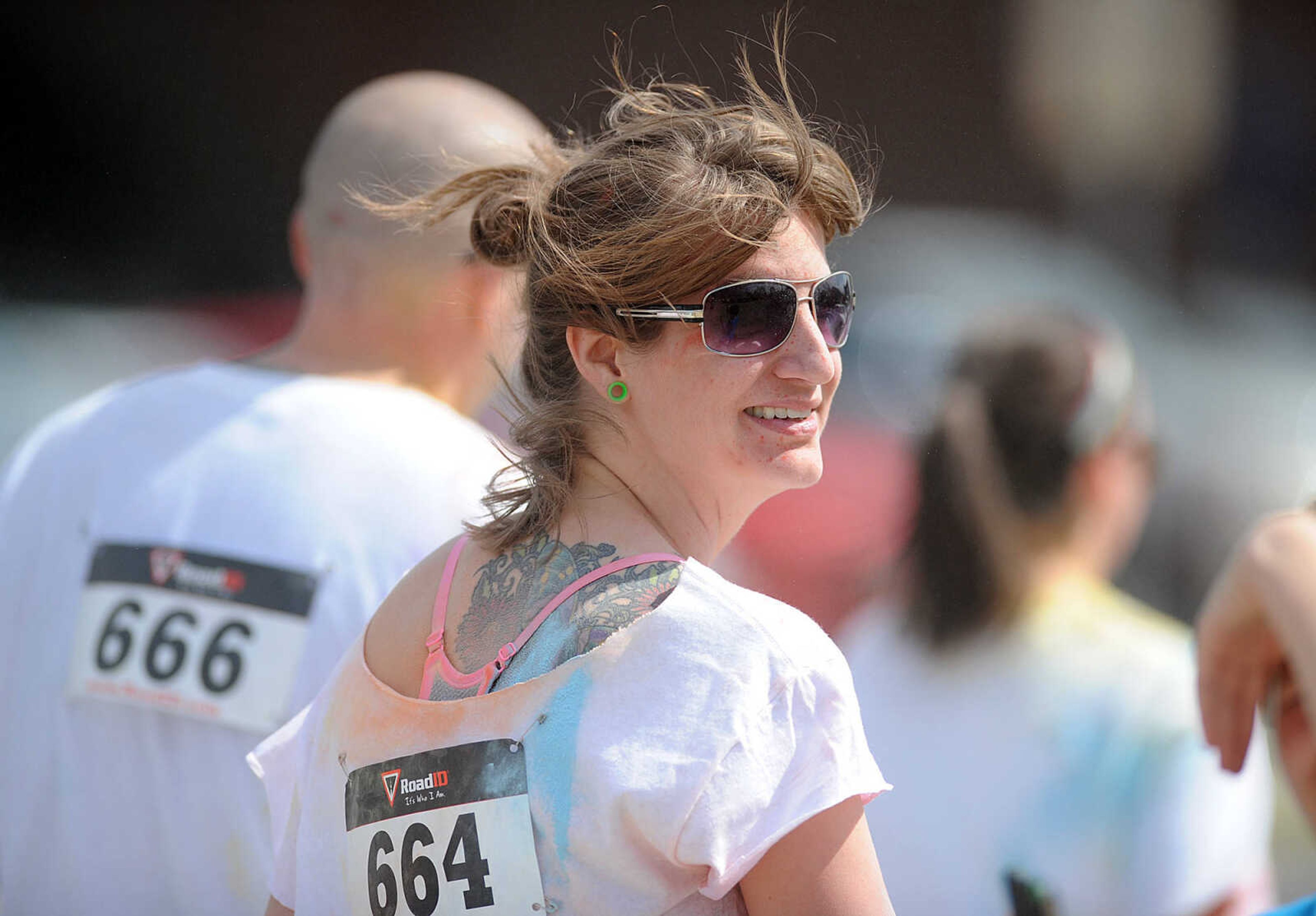 LAURA SIMON ~ lsimon@semissourian.com

Participants in the Color Me Cape 5K are sprayed with blue powder at the final color station on Main Street, Saturday, April 12, 2014, in Cape Girardeau.