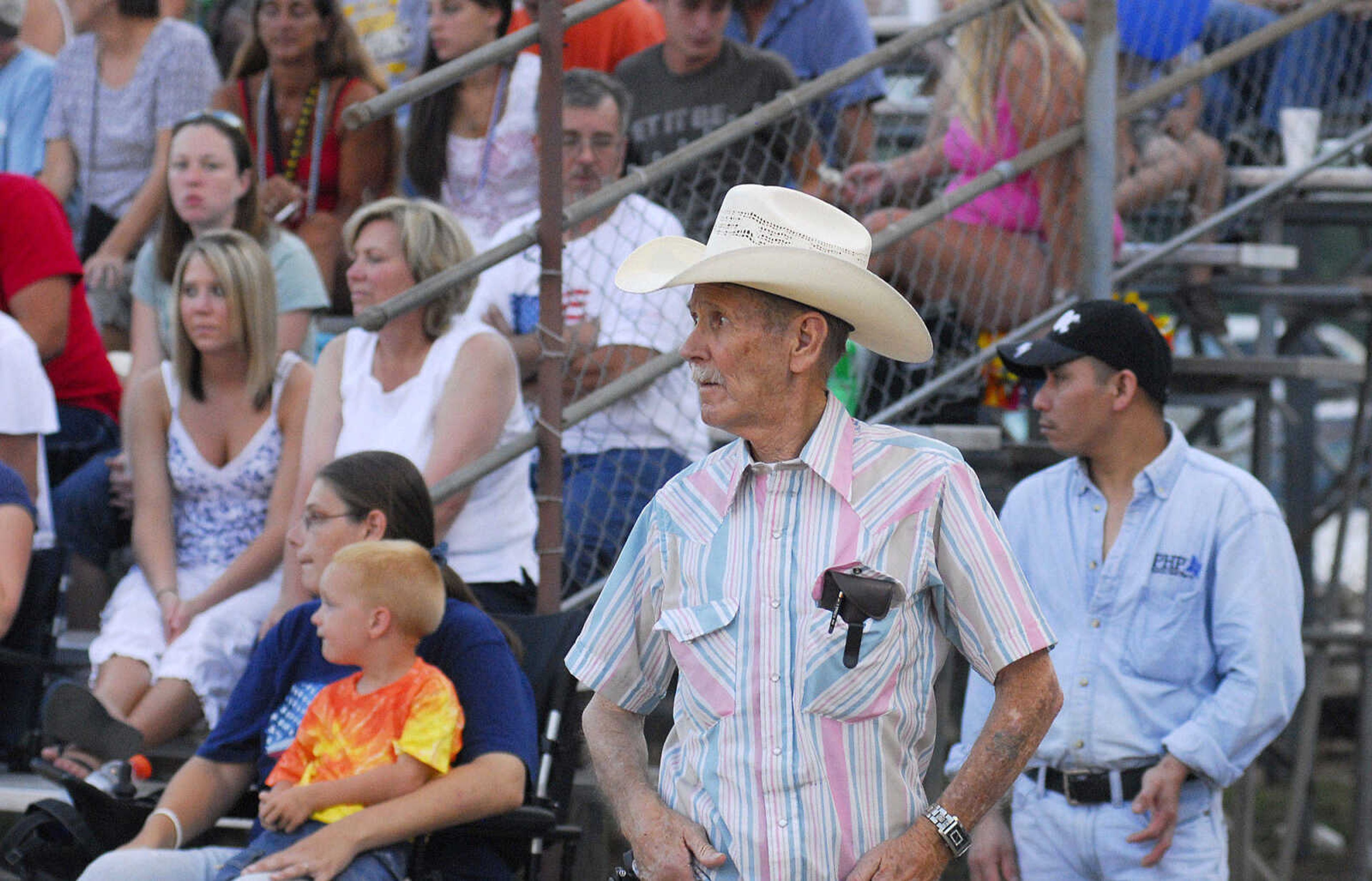 LAURA SIMON~lsimon@semissourian.com
Fans wait for the next group of derby cars to enter the grandstand during the U.S.A. Veterans Fourth of July celebration at Arena Park in Cape Girardeau Sunday, July 4, 2010.