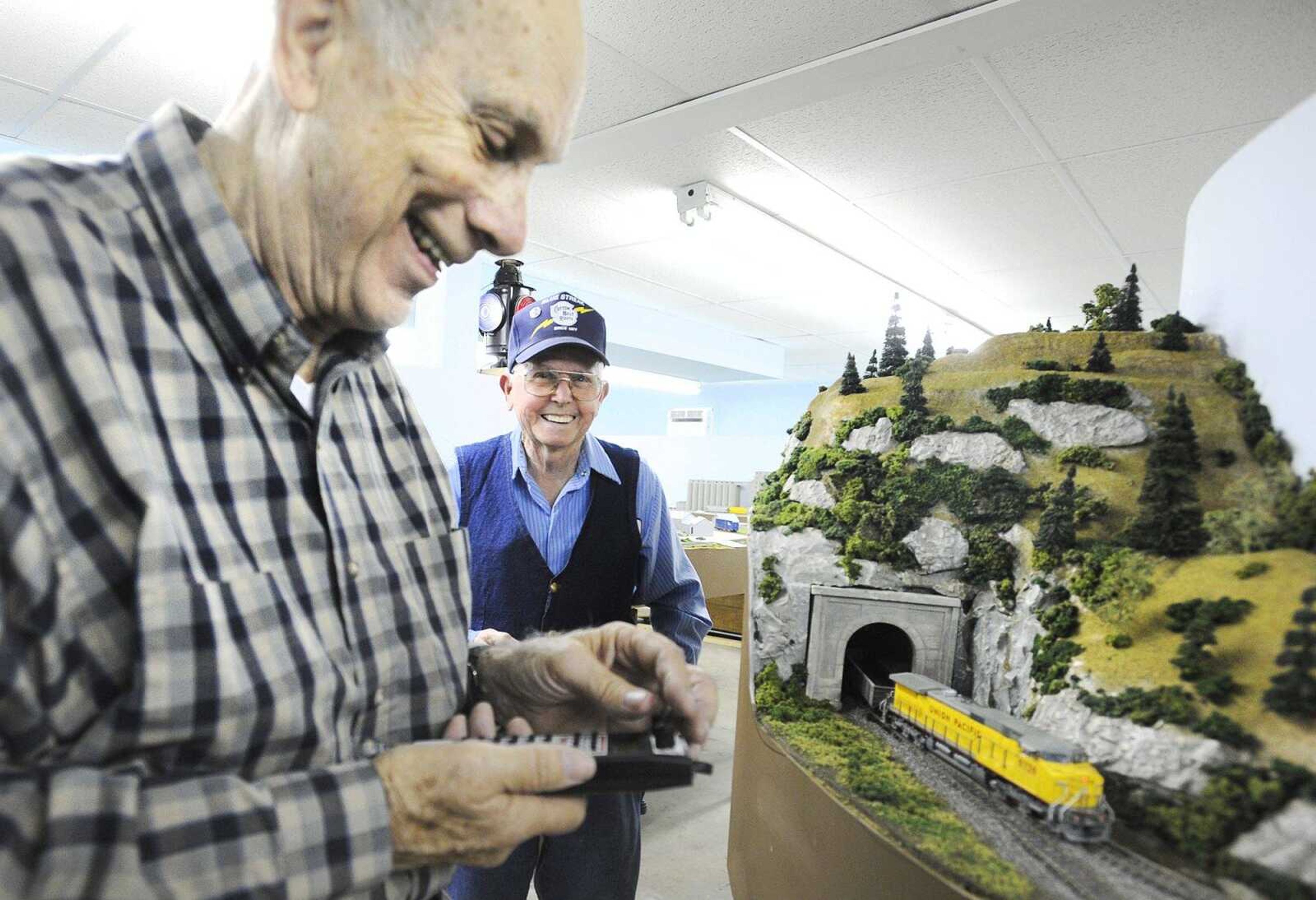 Ron Mason, right, giggles after highjacking Dean Coffin's remote control to his train Tuesday in Cape Girardeau. (Laura Simon)