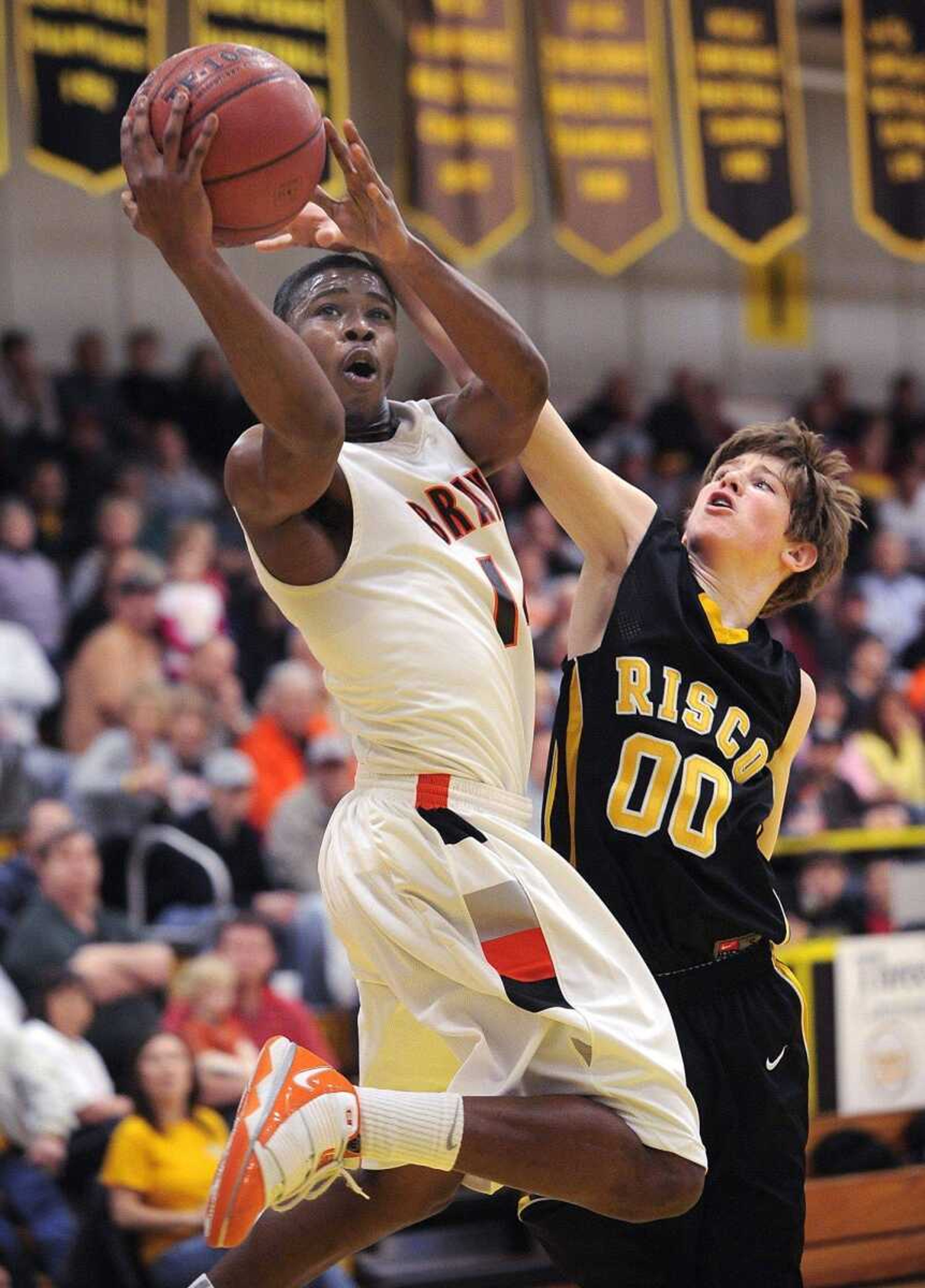 Scott County Central's Bobby Hatchett shoots as Risco's Gregory Bixler defends during their quarterfinal game Saturday. (Fred Lynch)