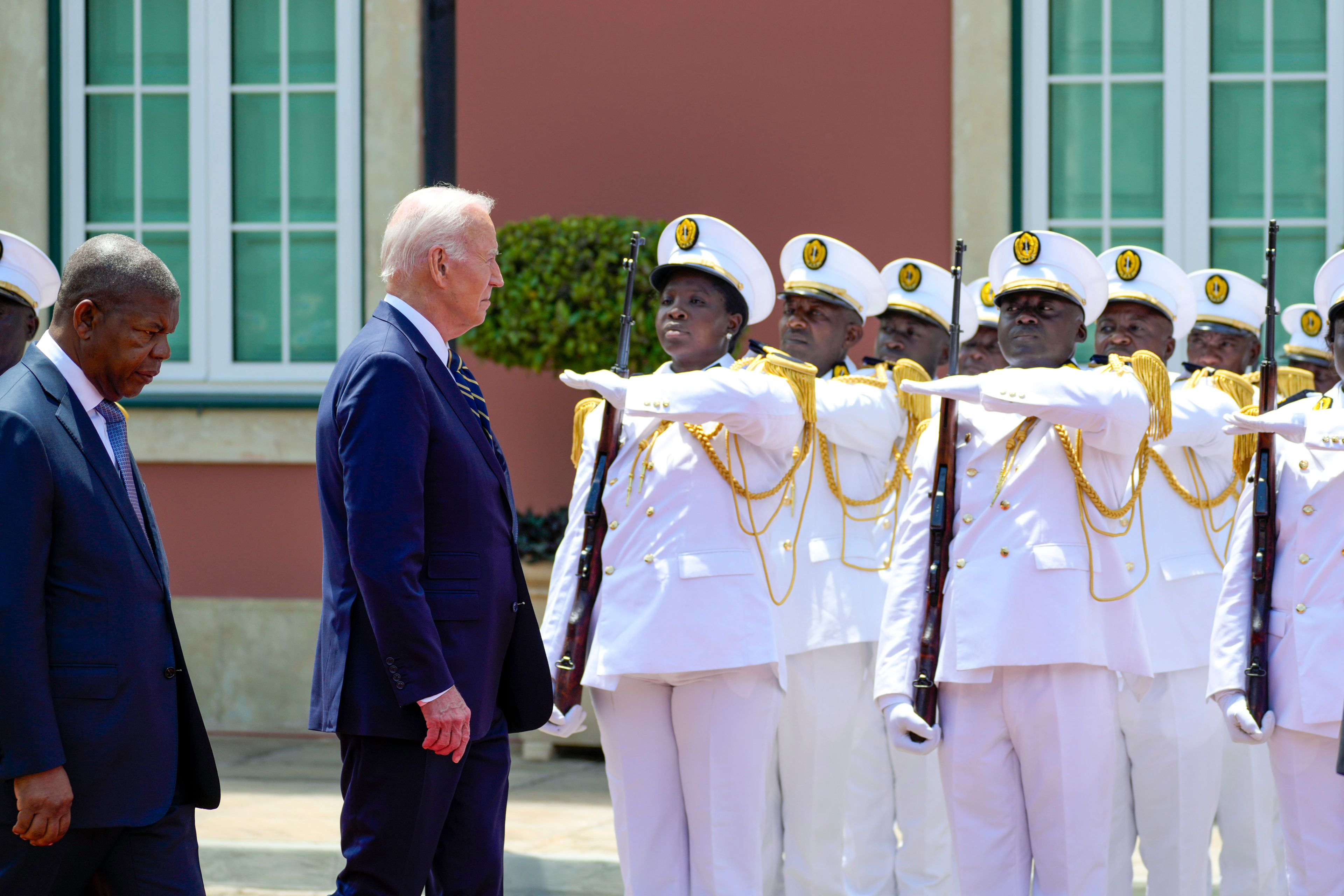 President Joe Biden inspects the honor guard with Angola's President Joao Lourenco, at the presidential palace in the capital Luanda, Angola on Tuesday, Dec. 3, 2024. (AP Photo/Ben Curtis)