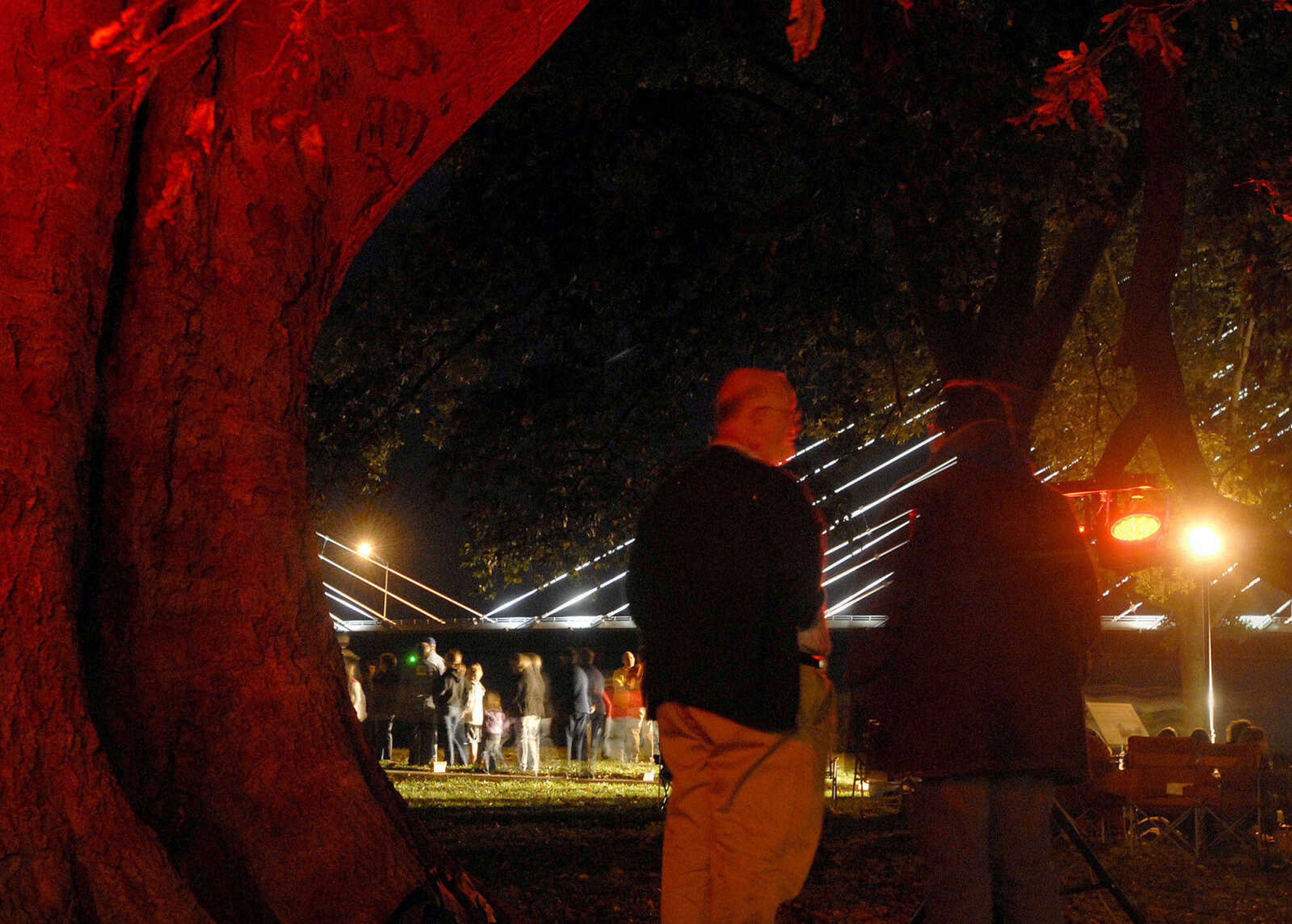 LAURA SIMON ~ lsimon@semissourian.com
The crowd listens to bone chilling tales from story tellers Regina Carpenter and Gayle Ross Friday, October 14, 2011 during an evening of Ghost Storytelling at the east lawn of the River Campus of Southeast Missouri State University in Cape Girardeau.