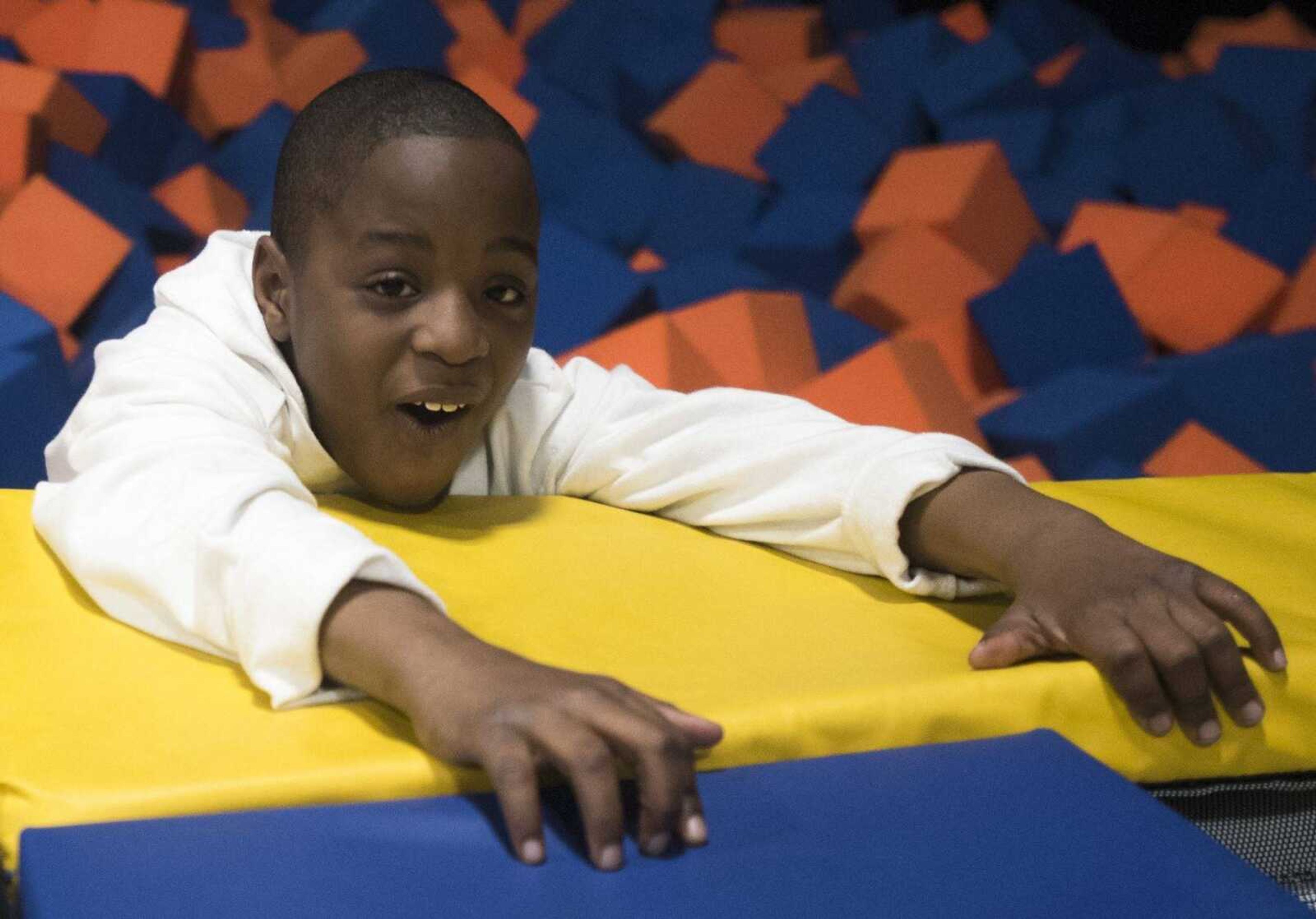 Brandon Barnes, 9, makes his way out of a foam pit Tuesday, Feb. 13, 2018, during an Easterseals Midwest monthly outing at Ultimate Air Trampoline Park in Scott City.