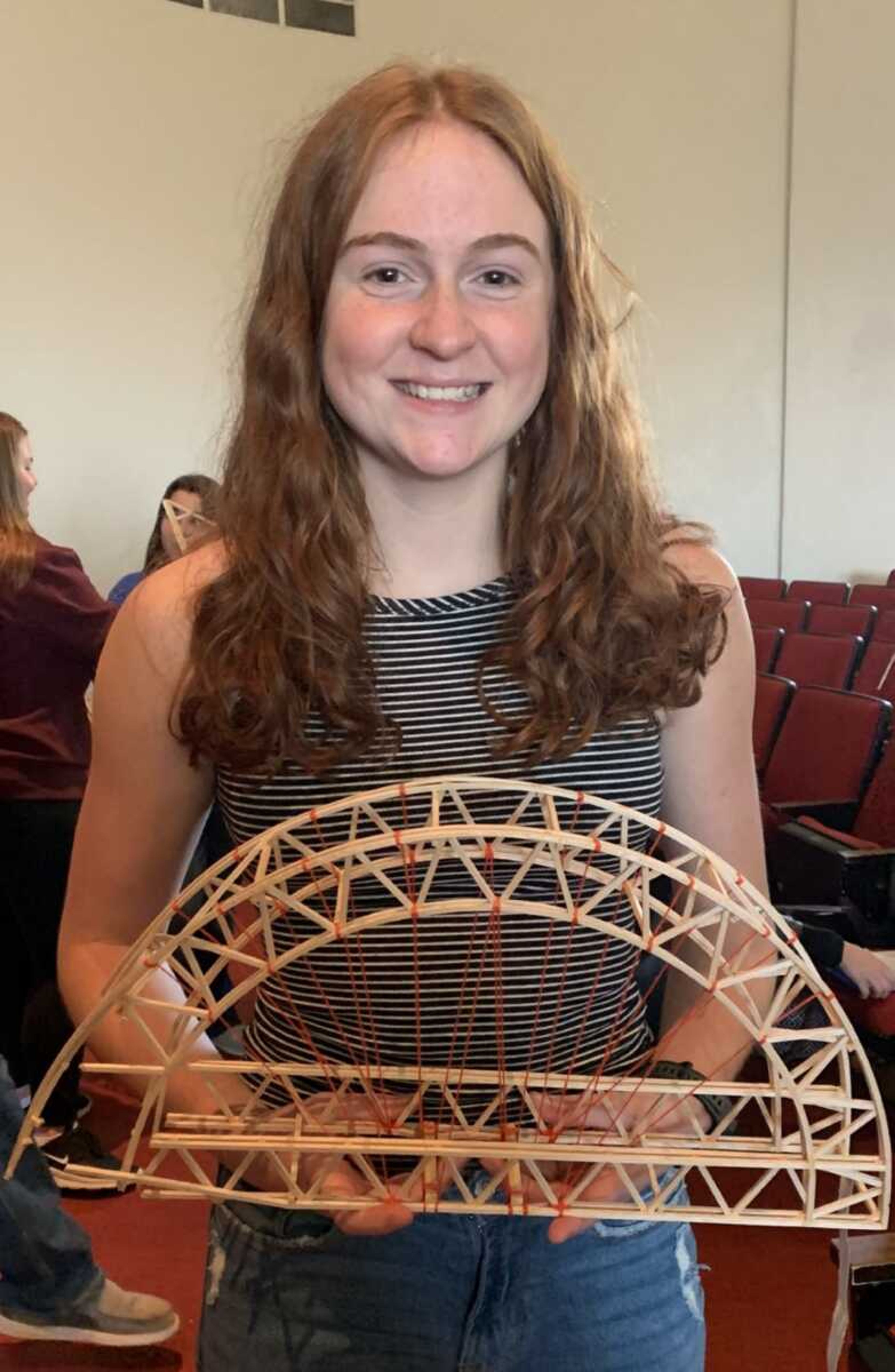 Chaffee High School's Ayne Held holds the model bridge she constructed for the Missouri Department of Transportation bridge-building competition Nov. 17, 2022, at Southeast Missouri State University in Cape Girardeau. Held won for the most aesthetic bridge design last year, as well as this year.