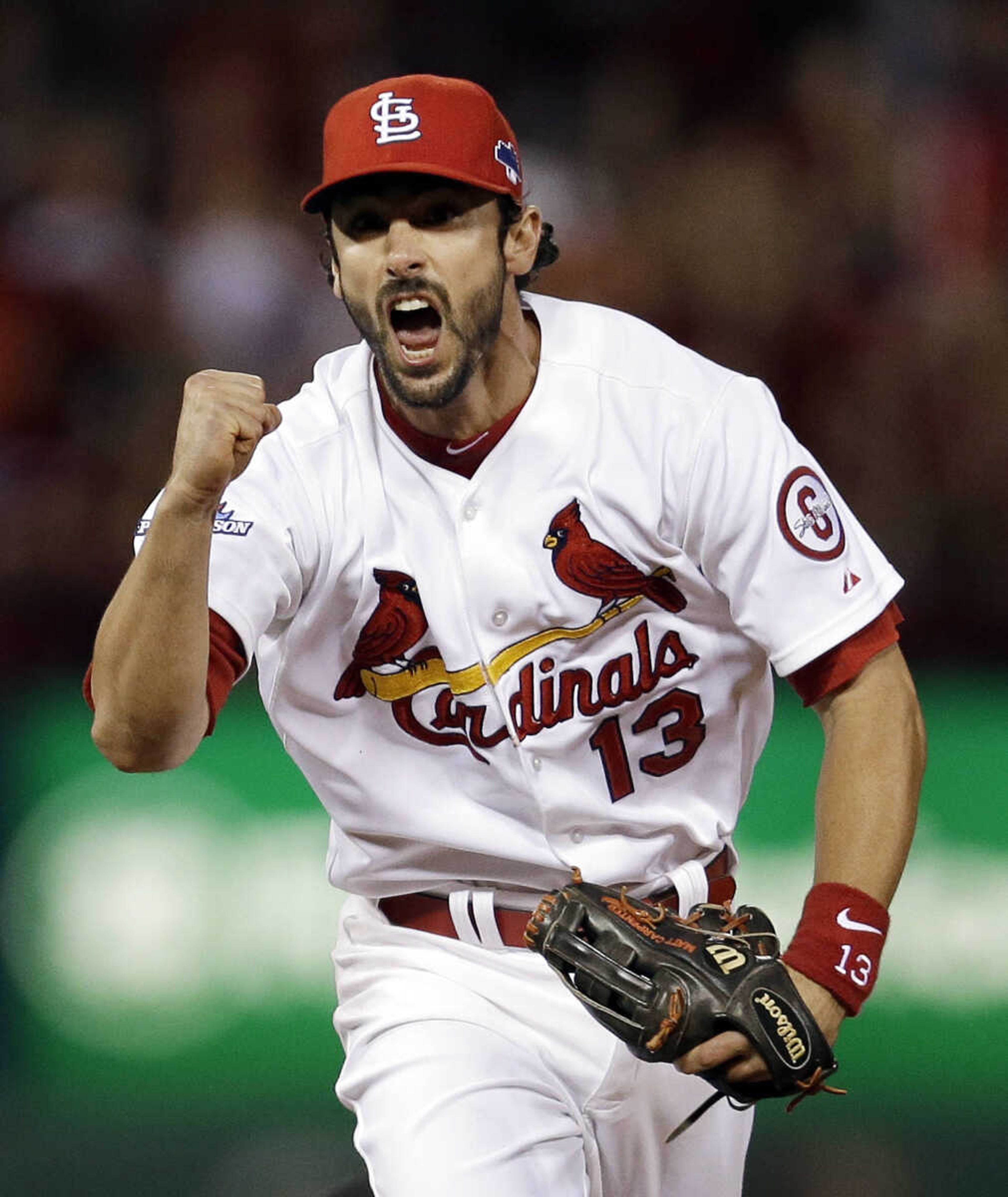 St. Louis Cardinals second baseman Matt Carpenter celebrates after turning a double play against the Pittsburgh Pirates to end the top of the sixth inning in Game 5 of a National League baseball division series, Wednesday, Oct. 9, 2013, in St. Louis. (AP Photo/Jeff Roberson)