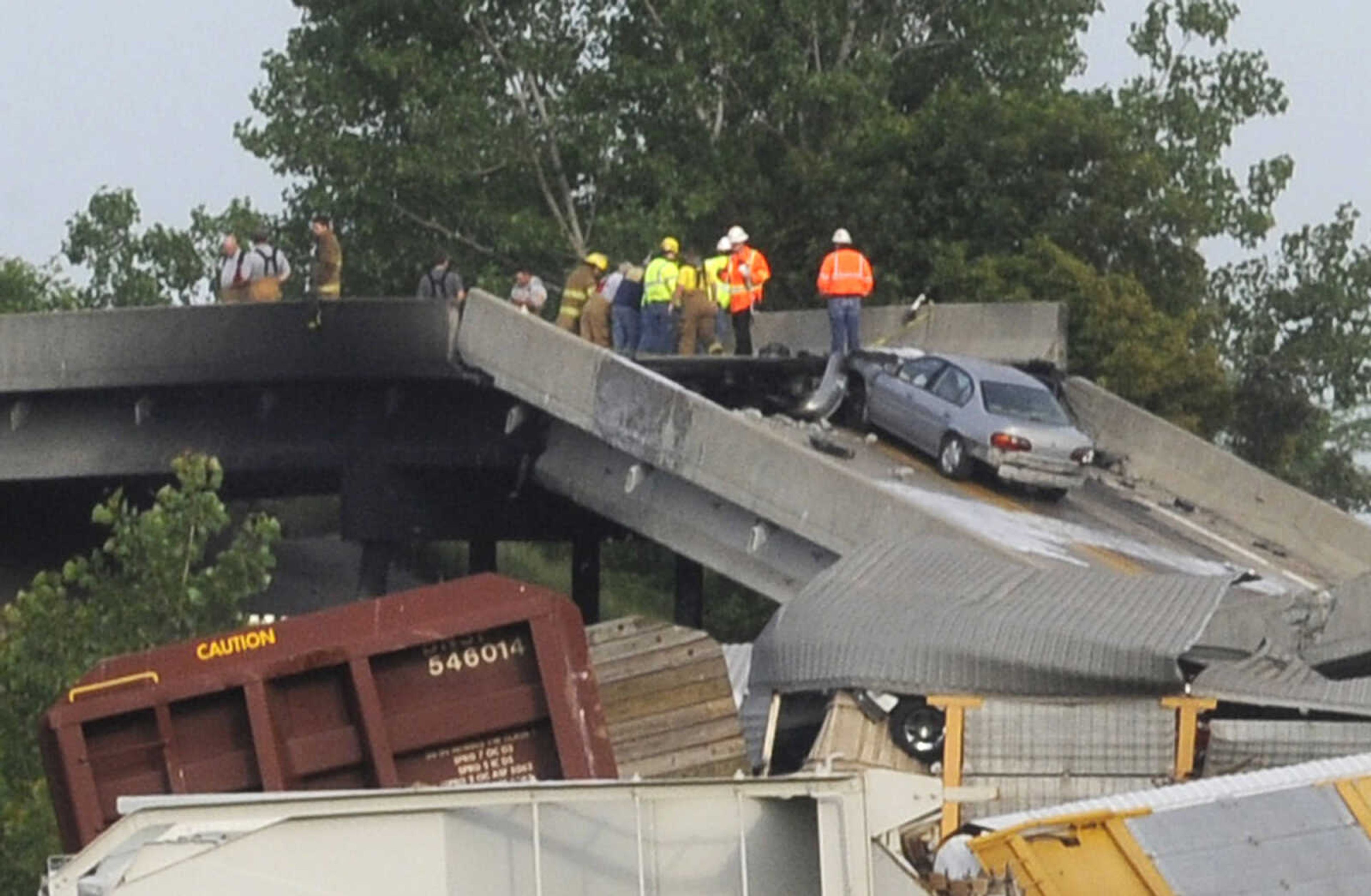 One of the two vehicles involved in the train crash is seen on the Route M overpass near Rockview, Mo. Saturday, May 25, 2013. Five people were injured and taken to a hospital. (Fred Lynch)